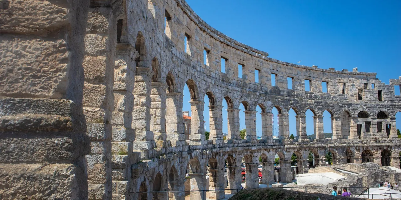 Explore the historic Roman amphitheatre ruins in Poreč, Croatia, showcasing ancient architecture.