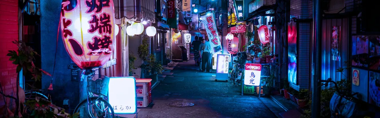 Explore a neon-lit Tokyo alleyway bustling with nightlife, vibrant colors, and cultural charm.