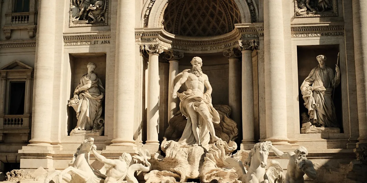 A detailed view of the iconic Trevi Fountain in Rome, showcasing its Baroque-style sculptures and architecture.