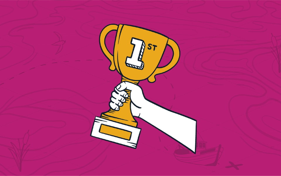 A hand holding a golden first-place trophy representing an MSP's winning line of questions to customers.