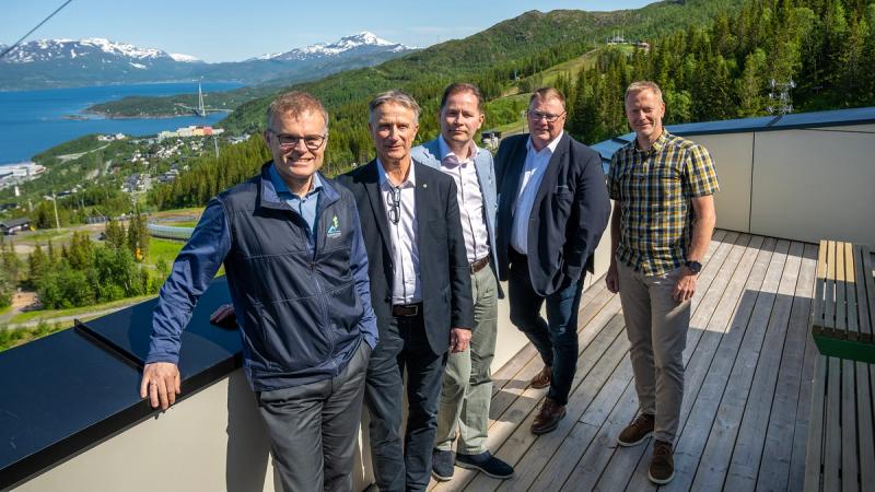 Photo of five men overlooking Narvik and Ofotfjorden