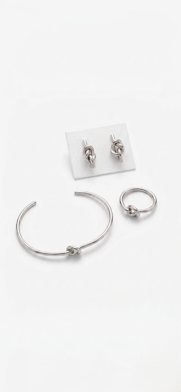 Juego de Pulso, Anillo y Aretes de Nudos en Plata Lisa