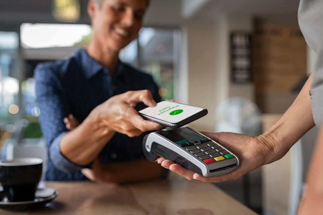 Contactless mobile payment at checkout.
