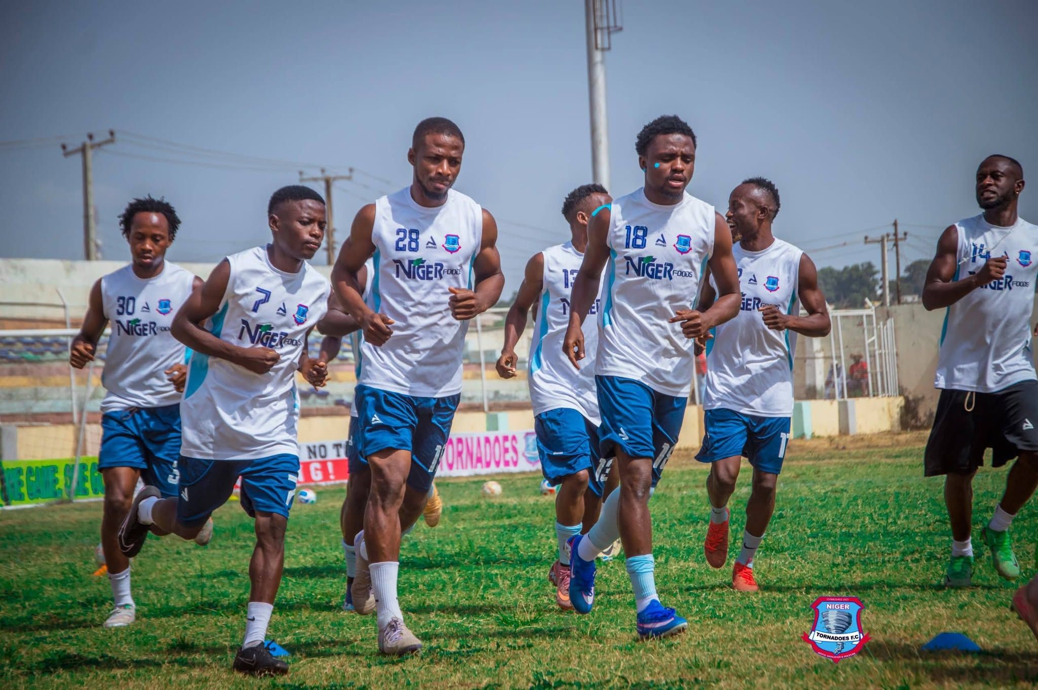 Players jogging together during training