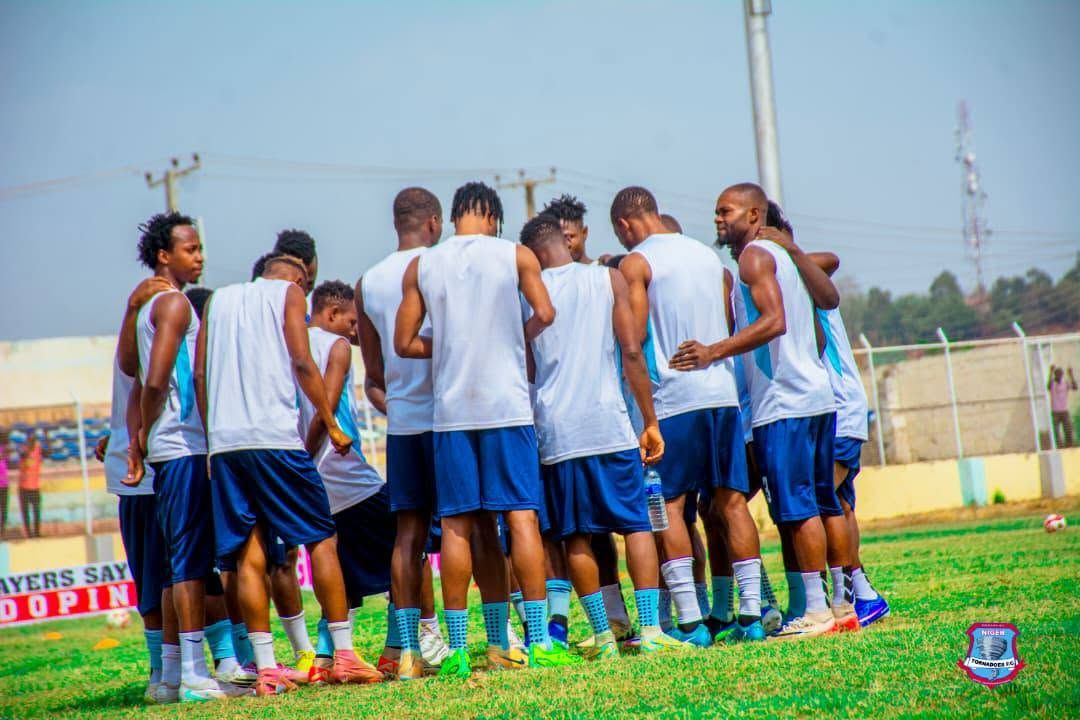 Squad huddled together during a training session