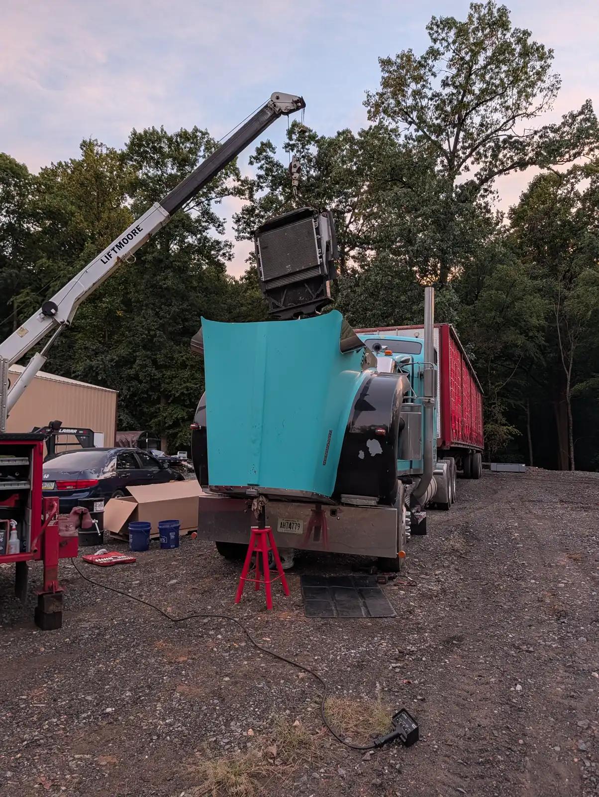 Equipment and service truck at dusk during truck and heavy equipment service
