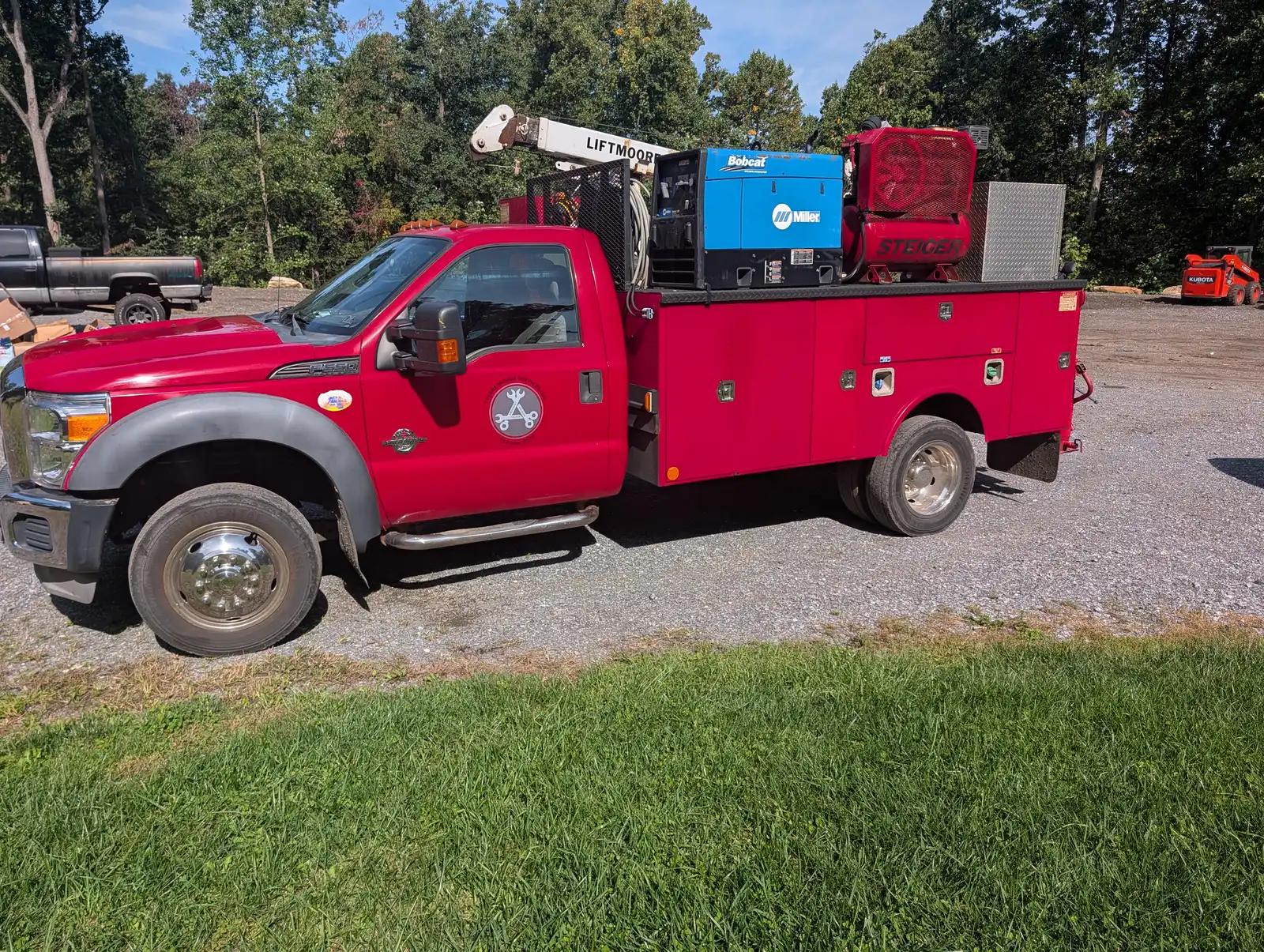 Tyler’s red mobile service truck during truck and heavy equipment service