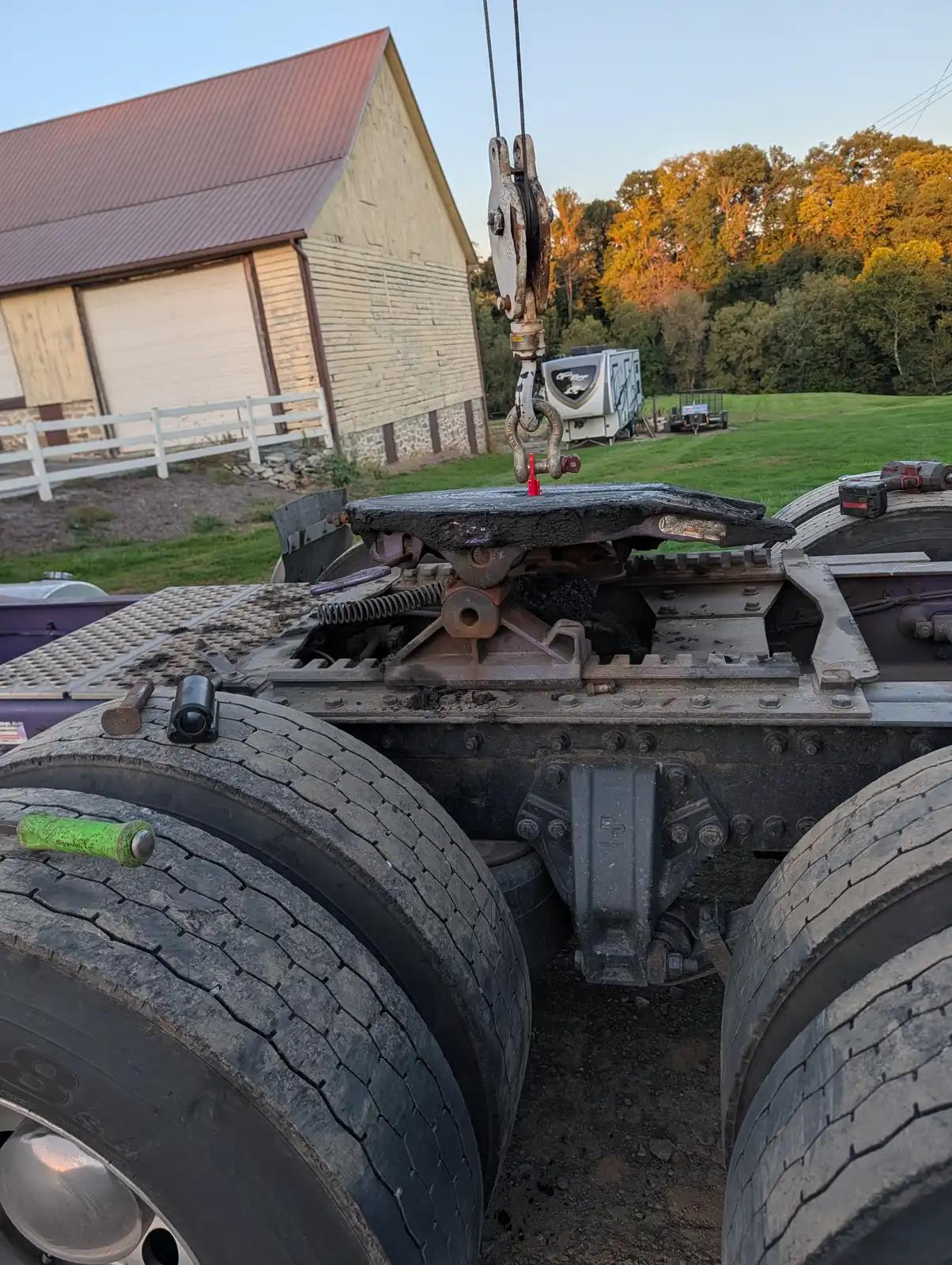 Tracked equipment beside a building during truck and heavy equipment service