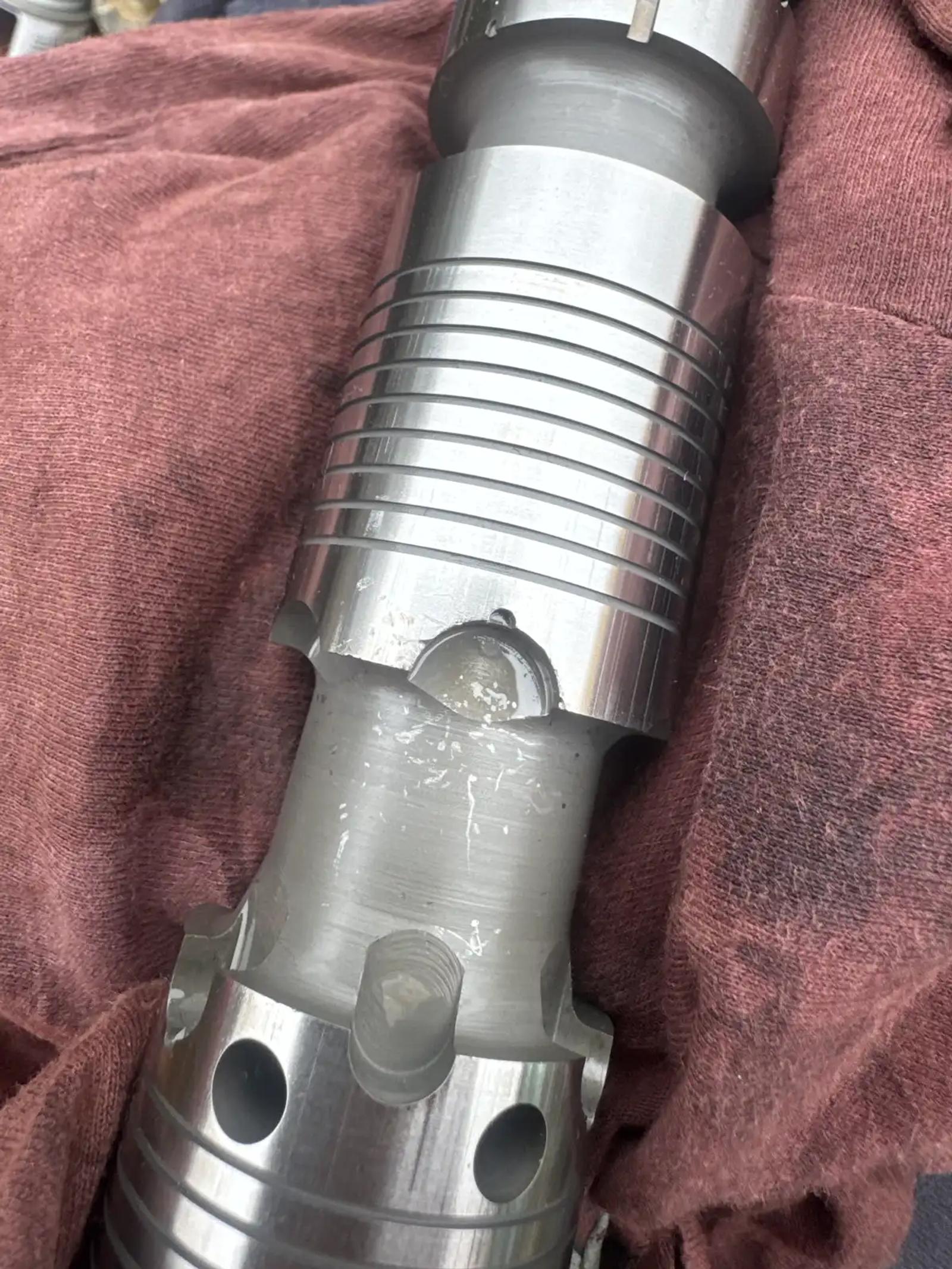 Removed cylinder component during truck and heavy equipment service