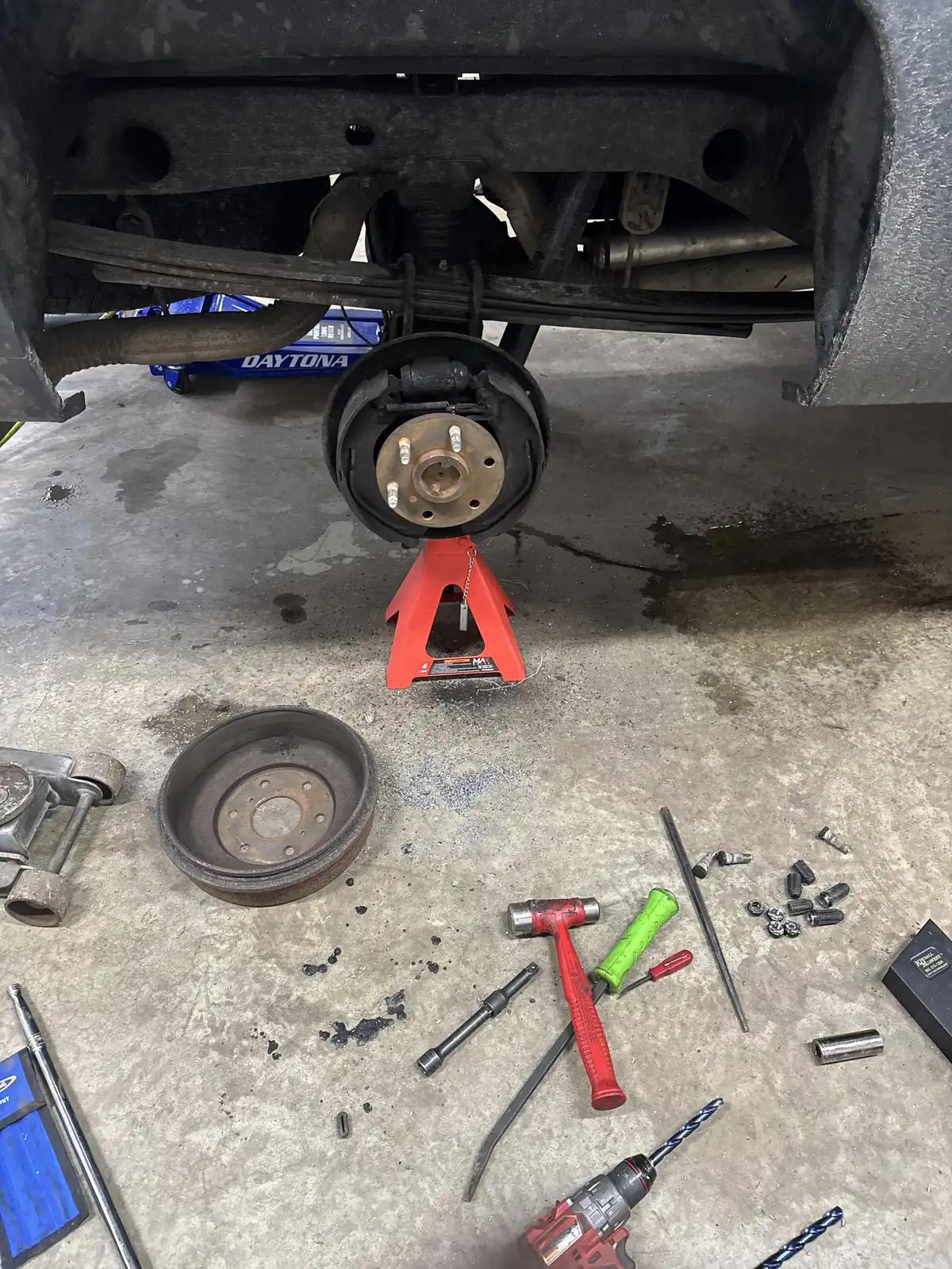 Raised truck axle and hub during truck and heavy equipment service