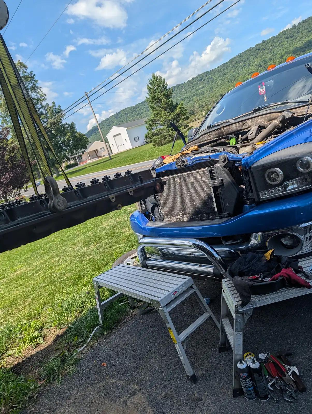 Engine access with service tools during truck and heavy equipment service