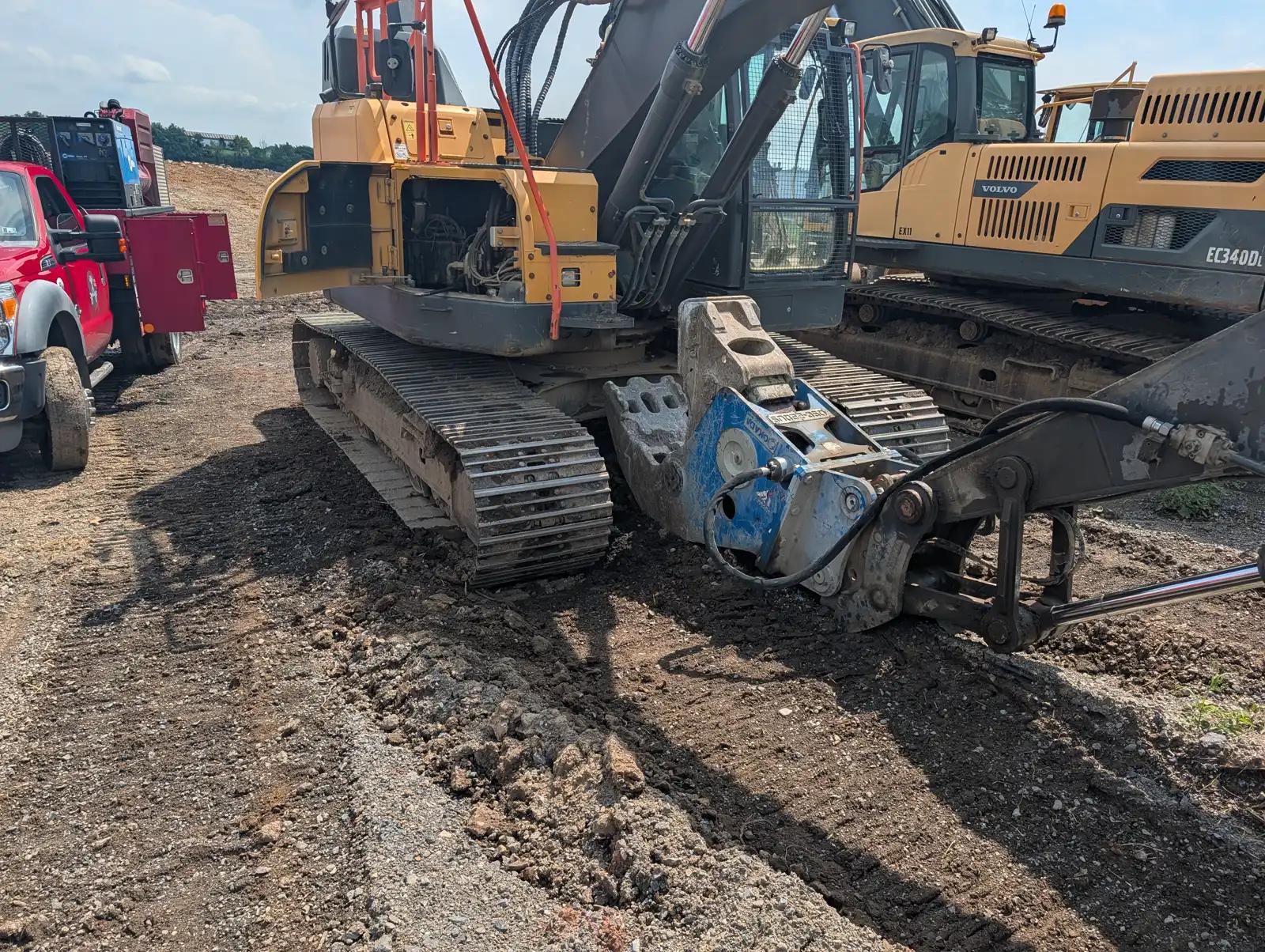 Heavy equipment with service truck during truck and heavy equipment service
