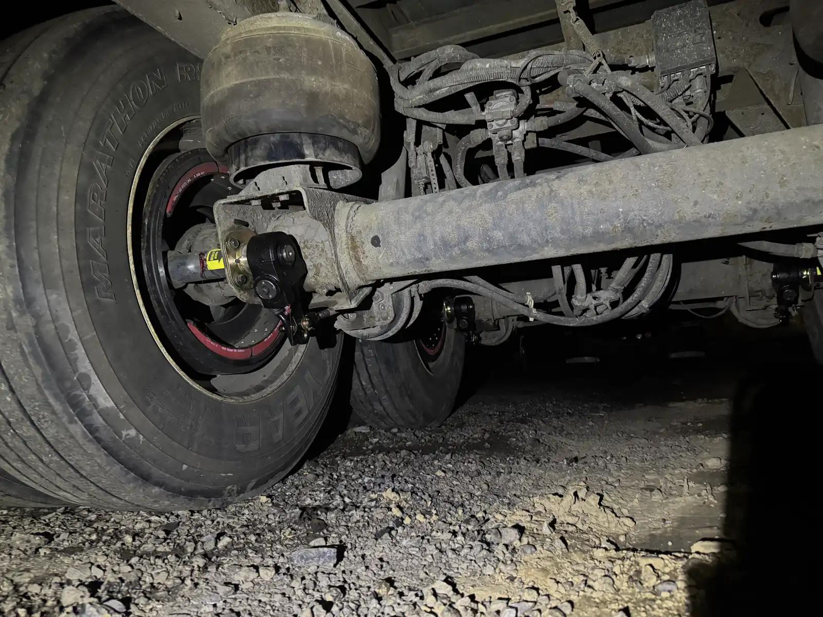 Truck suspension and axle during truck and heavy equipment service
