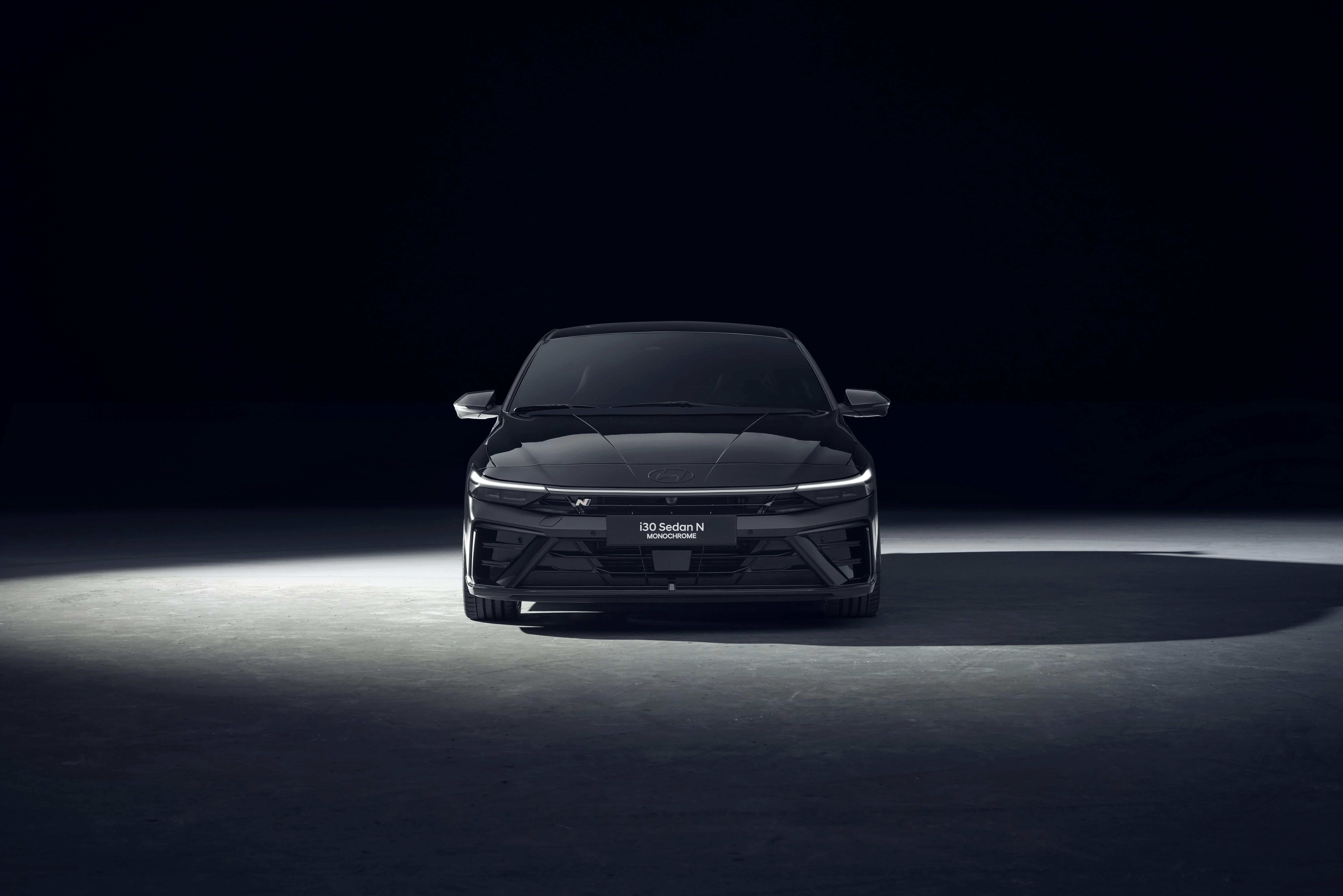 Front view of the Hyundai i30 Sedan N MONOCHROME in Abyss Black Pearl
