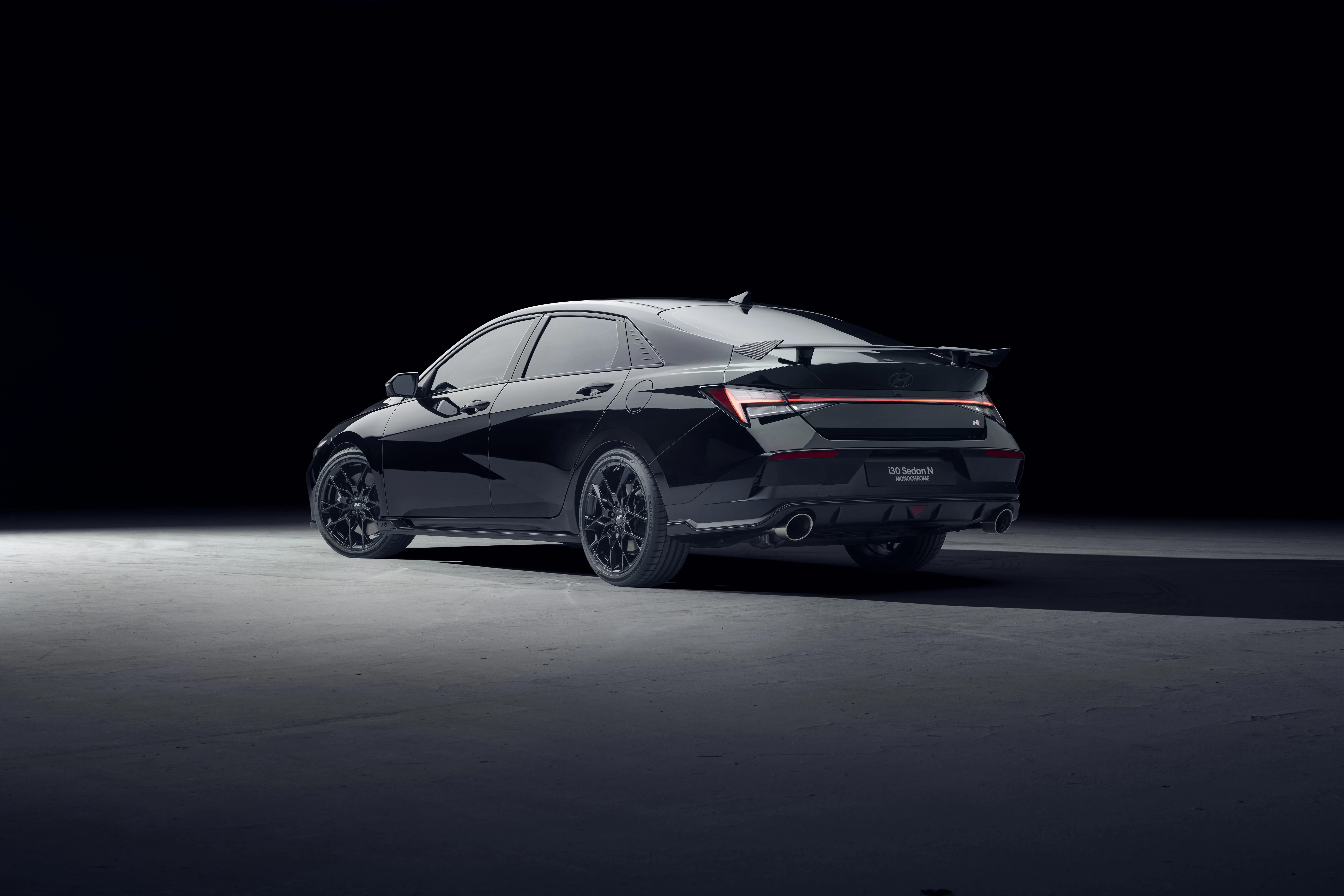 Rear three-quarter view of the Hyundai i30 Sedan N MONOCHROME in black