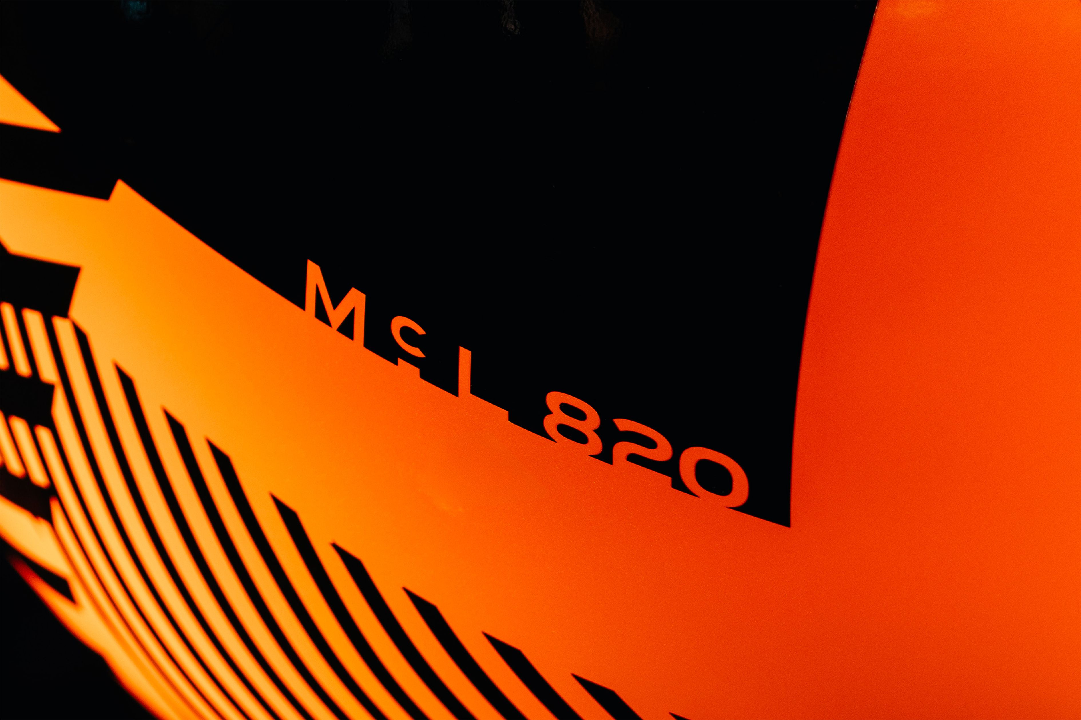 McL 820 lettering on the camouflaged McLaren kiwi statue