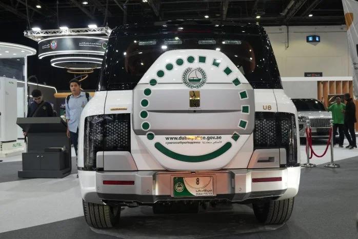 Rear of the Dubai Police BYD Yangwang U8 patrol SUV with its spare wheel cover and police livery