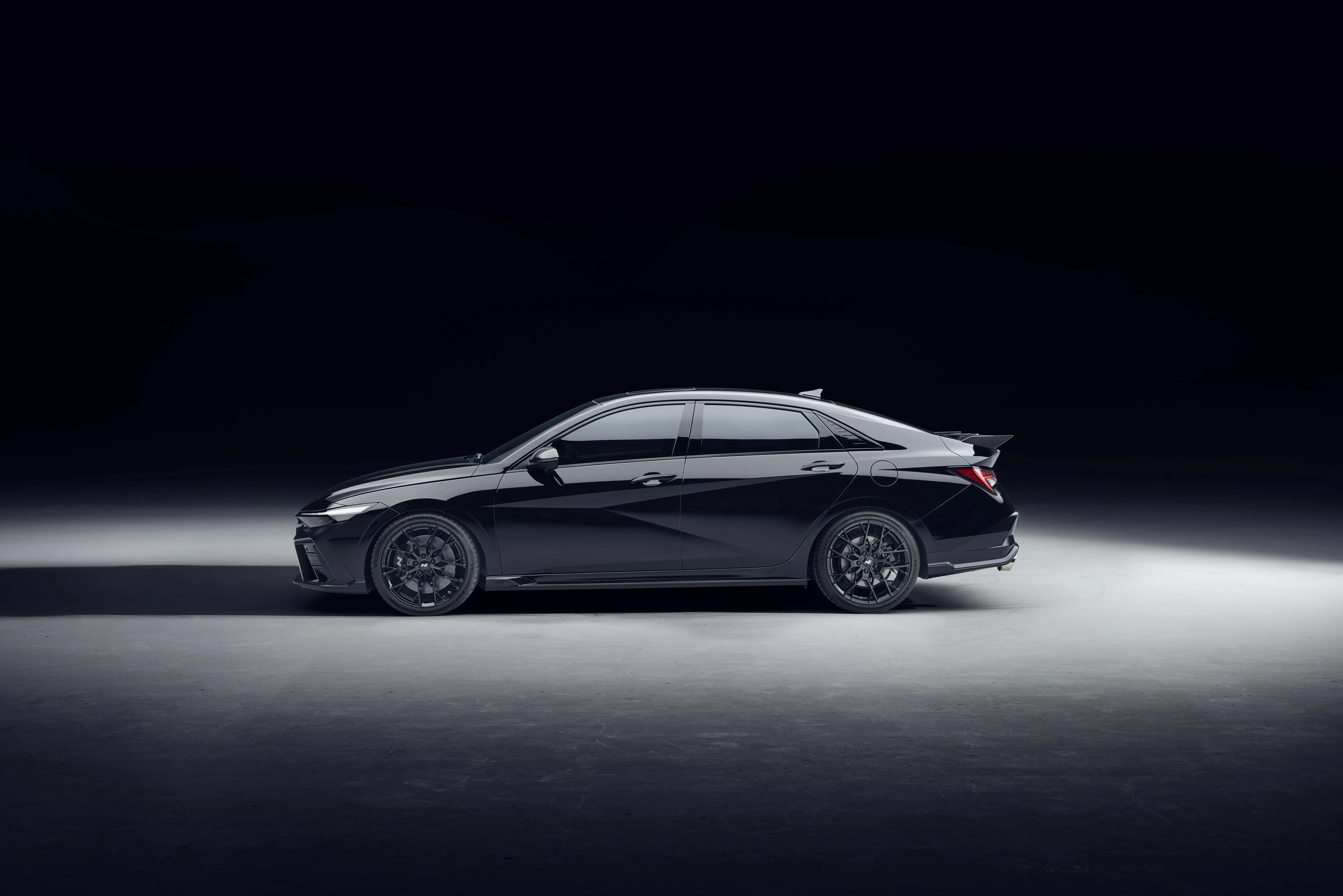 Side profile of the Hyundai i30 Sedan N MONOCHROME in black