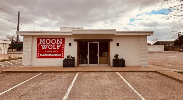 The Moon Wolf Provisions building at 920 Custer Rd on an overcast Richardson TX afternoon — a head-on view of the storefront for locals looking for a coffee shop in Richardson