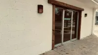 The Moon Wolf Provisions storefront entry at 920 Custer Rd, Richardson TX — a quiet workspace door for working-from-cafe locals