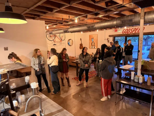 A Moon Wolf event in full swing under the GODSPEED sign — the kind of room weddings and private events become when the trailer rolls up