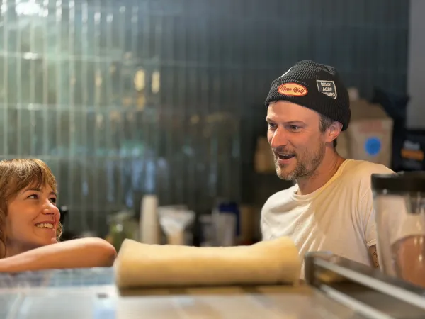 Behind the bar at Moon Wolf Provisions, Richardson TX — Richie and a barista mid-shift, the kind of conversation a Richardson afternoon turns into