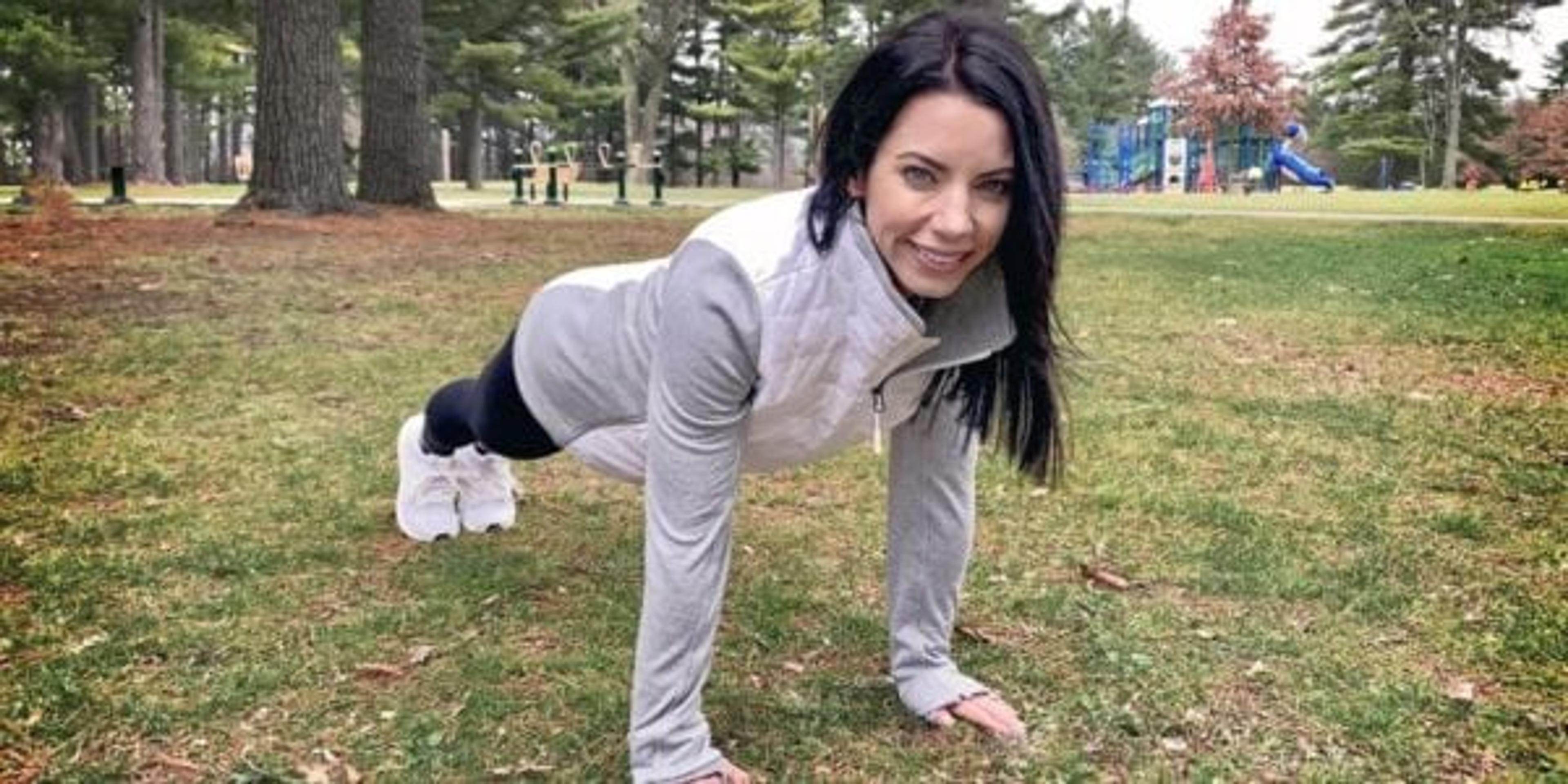 Ann Marie Wakula demonstrates a workout in a park.