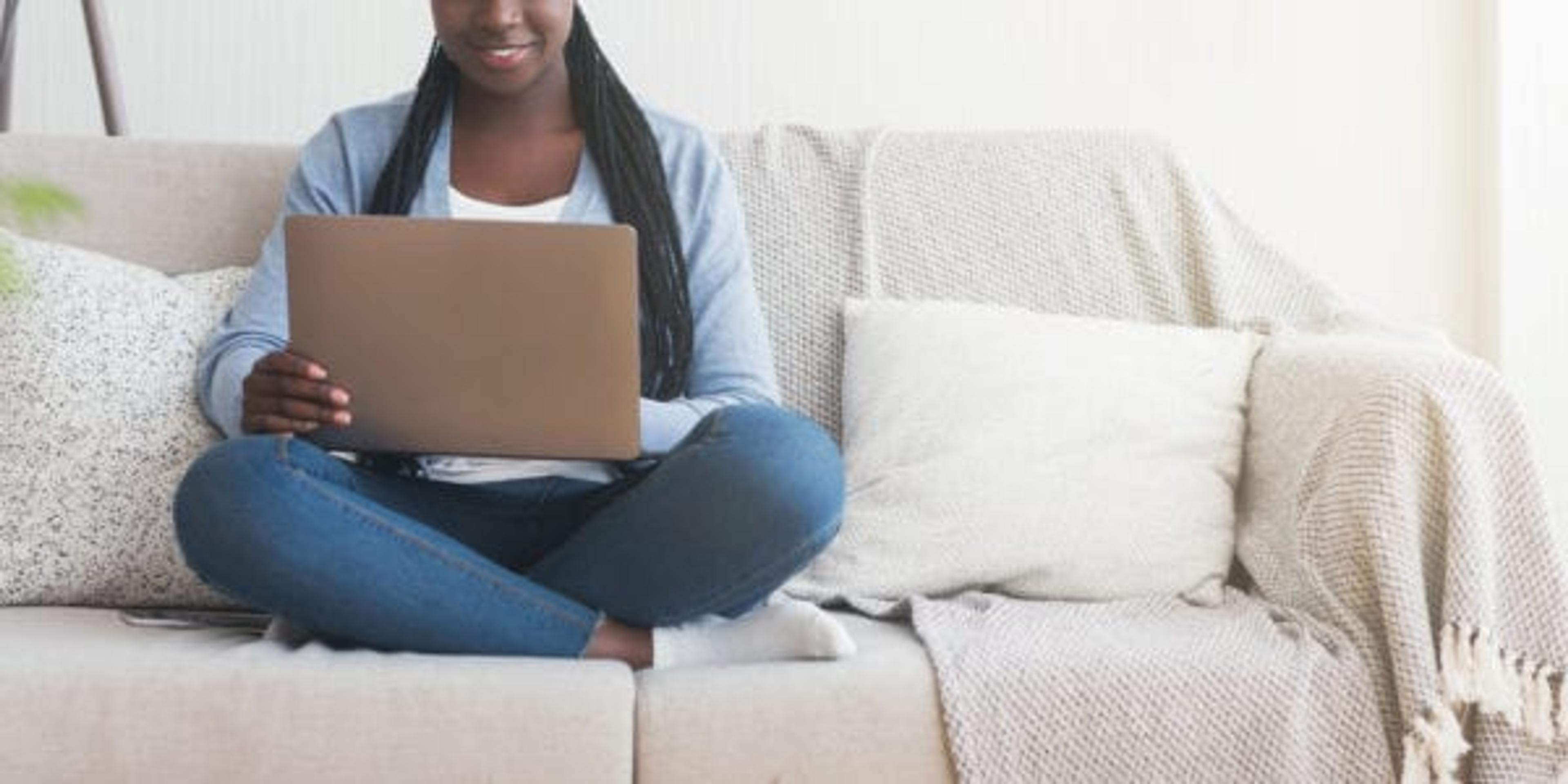 Woman watching webinar at home