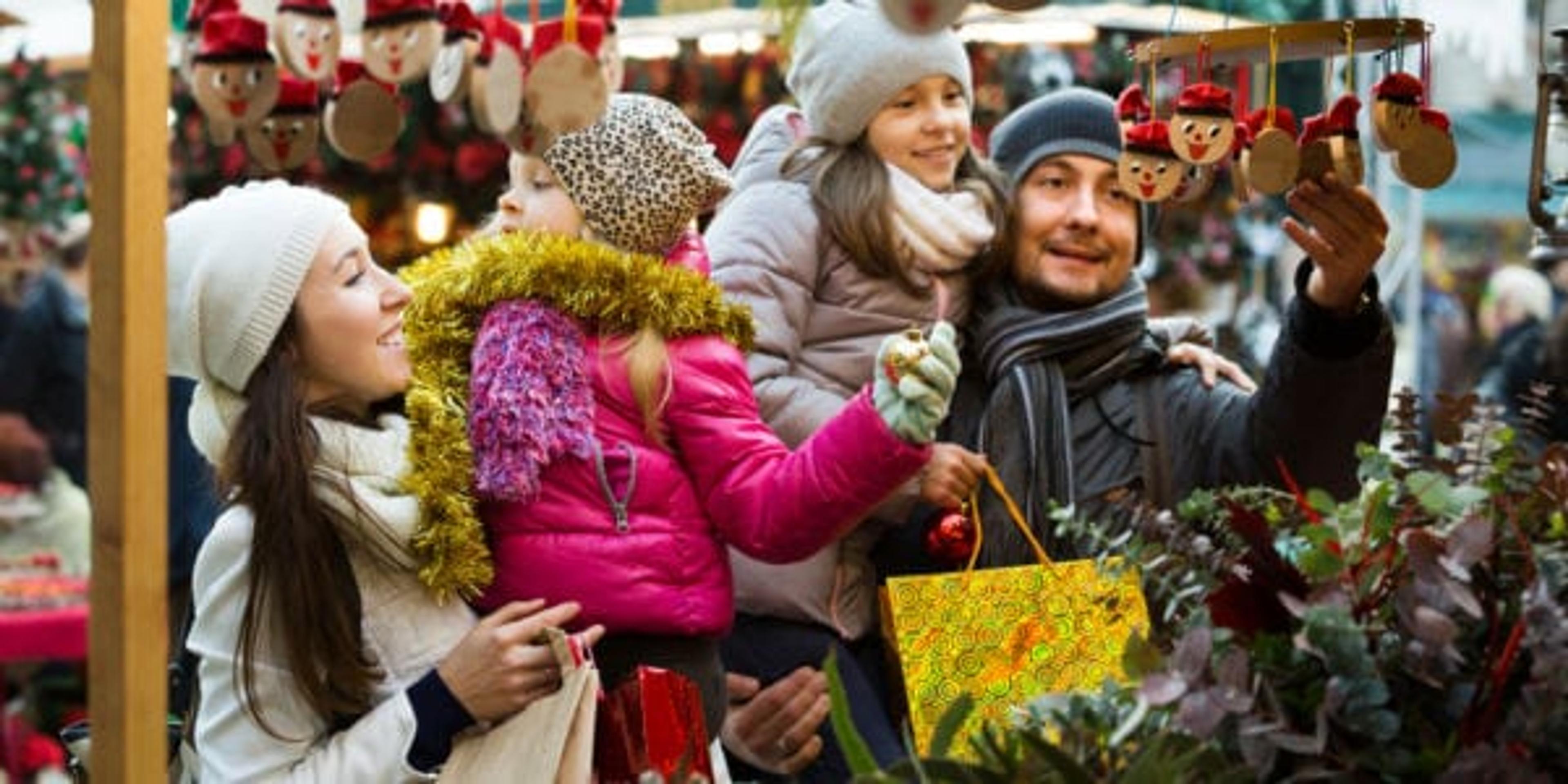 Family with children purchasing toys