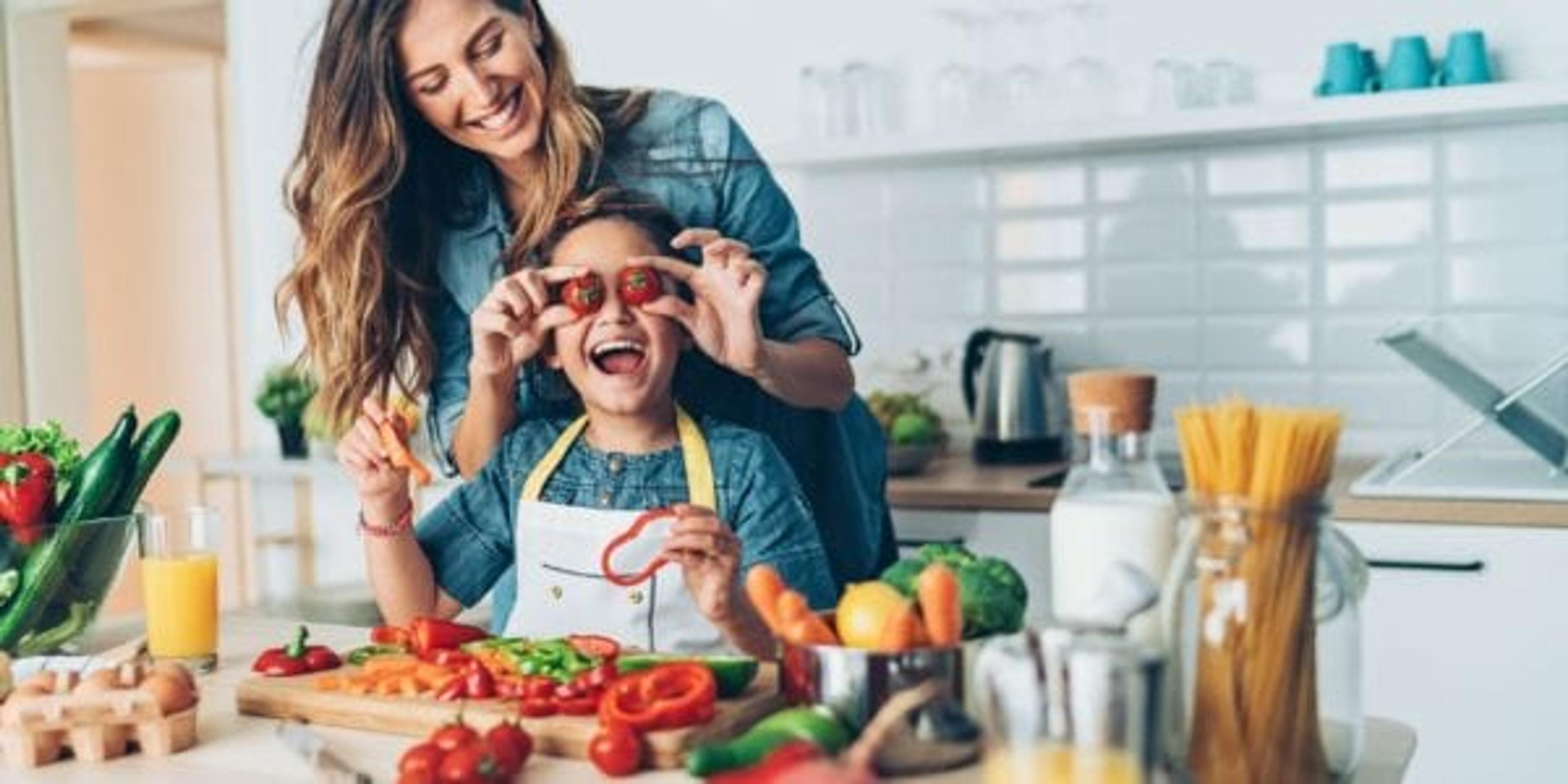Woman preparing healthy food with her daughter