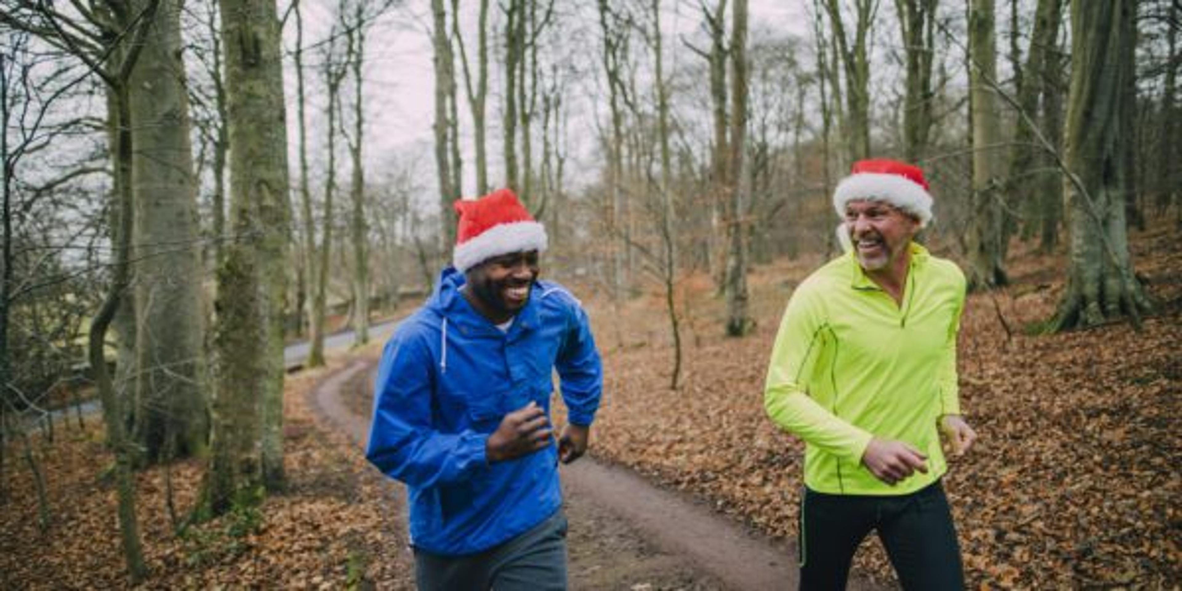 Two friends jogging up the trails in the forest to get fit in the middle of December!