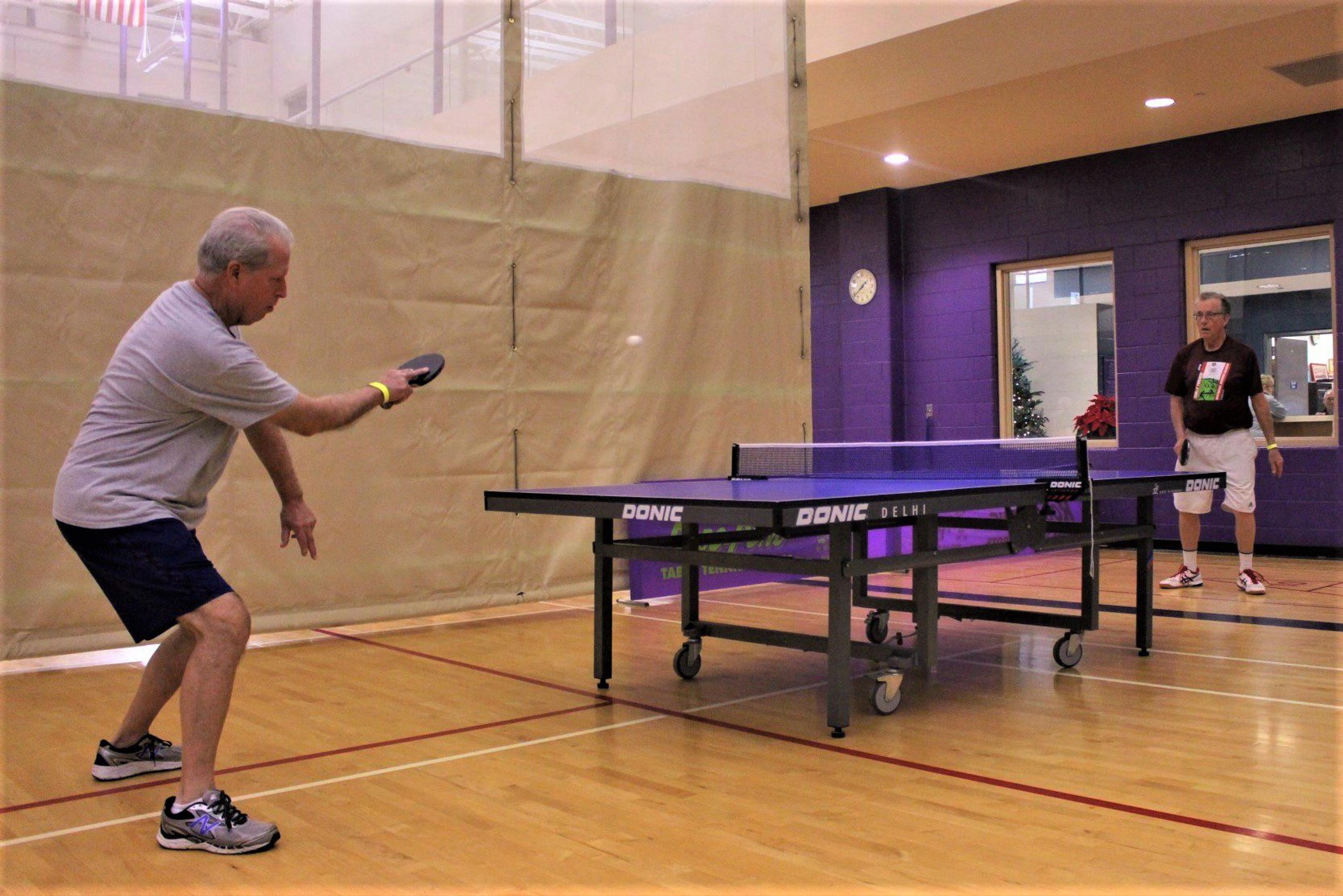 Bob Van Camp plays table tennis at the Older Persons Commission