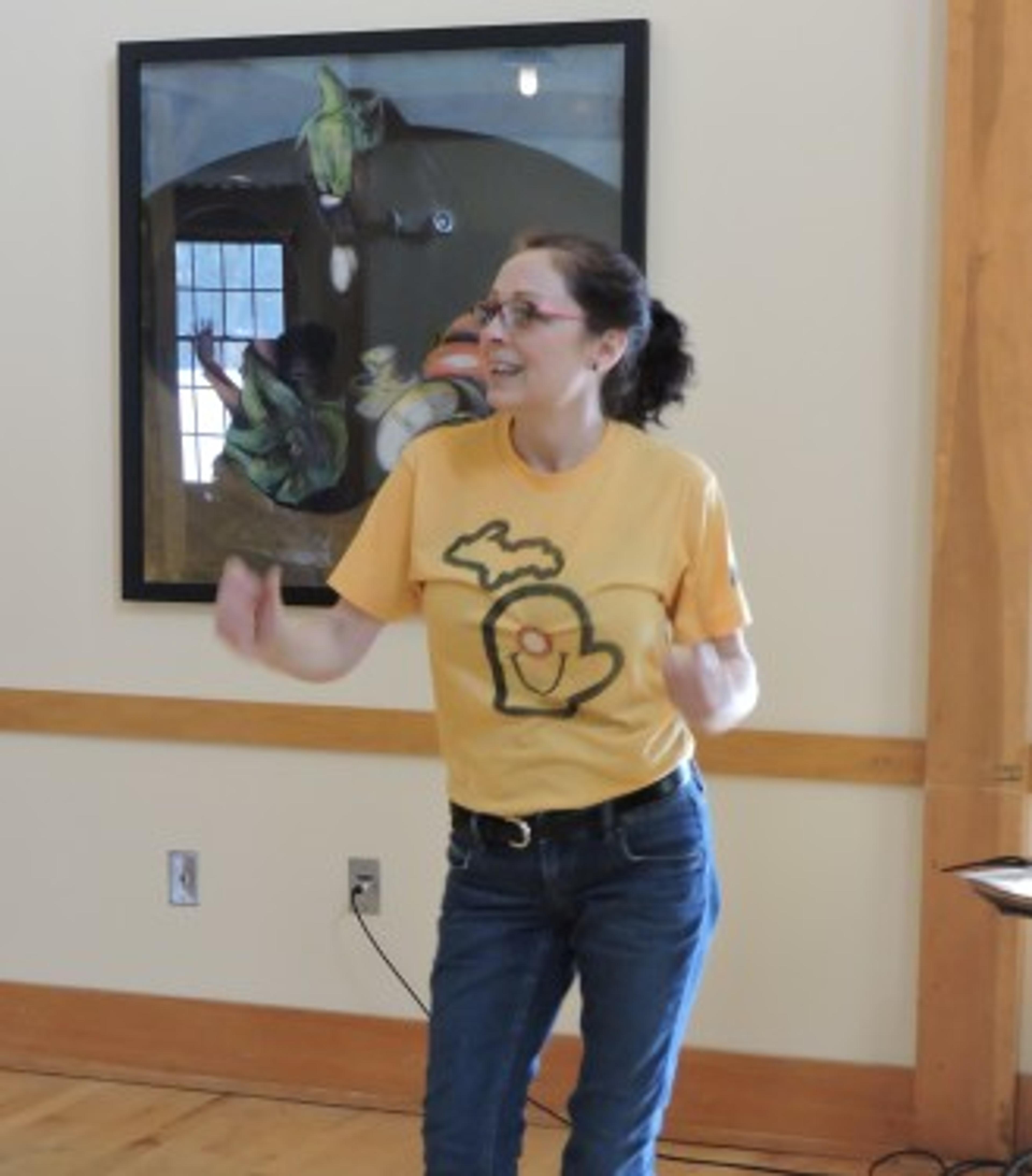 Angēla Essick Dykes leading a session of laughter yoga at LaughFest.