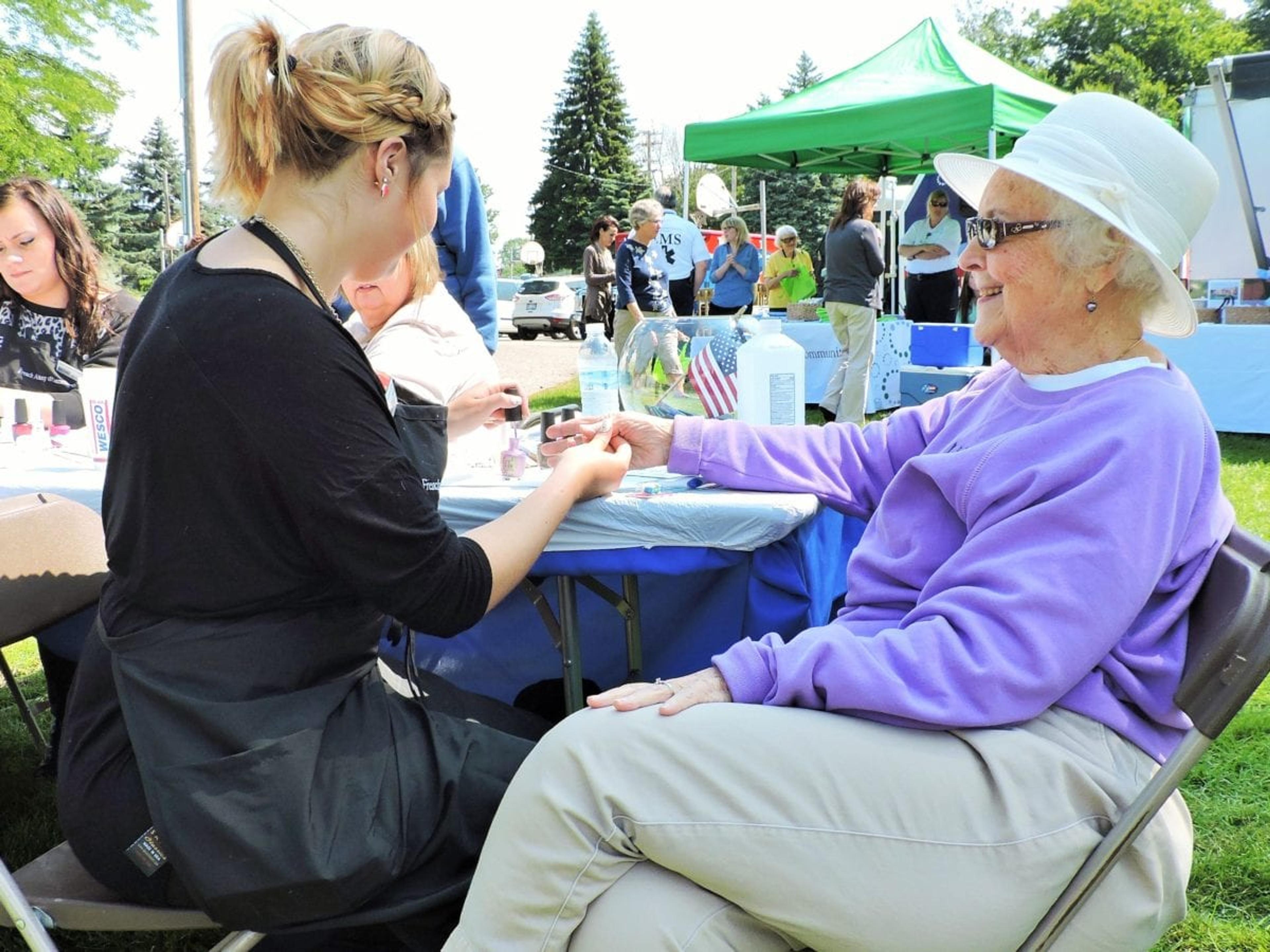Libby Sielski has her nails painted by Sarah Smith from French Academy of Cosmetology.