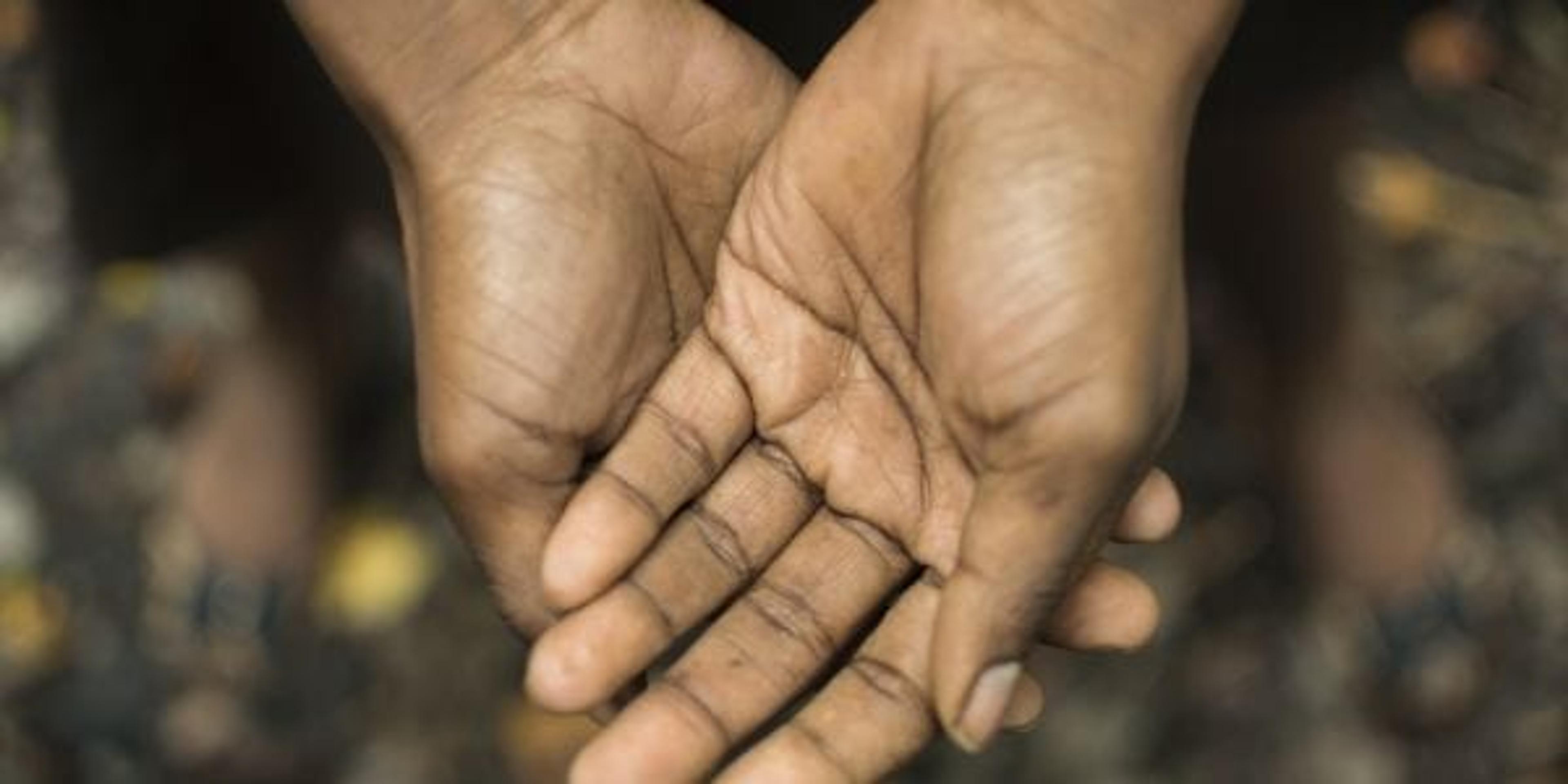 Image of hands held upward.