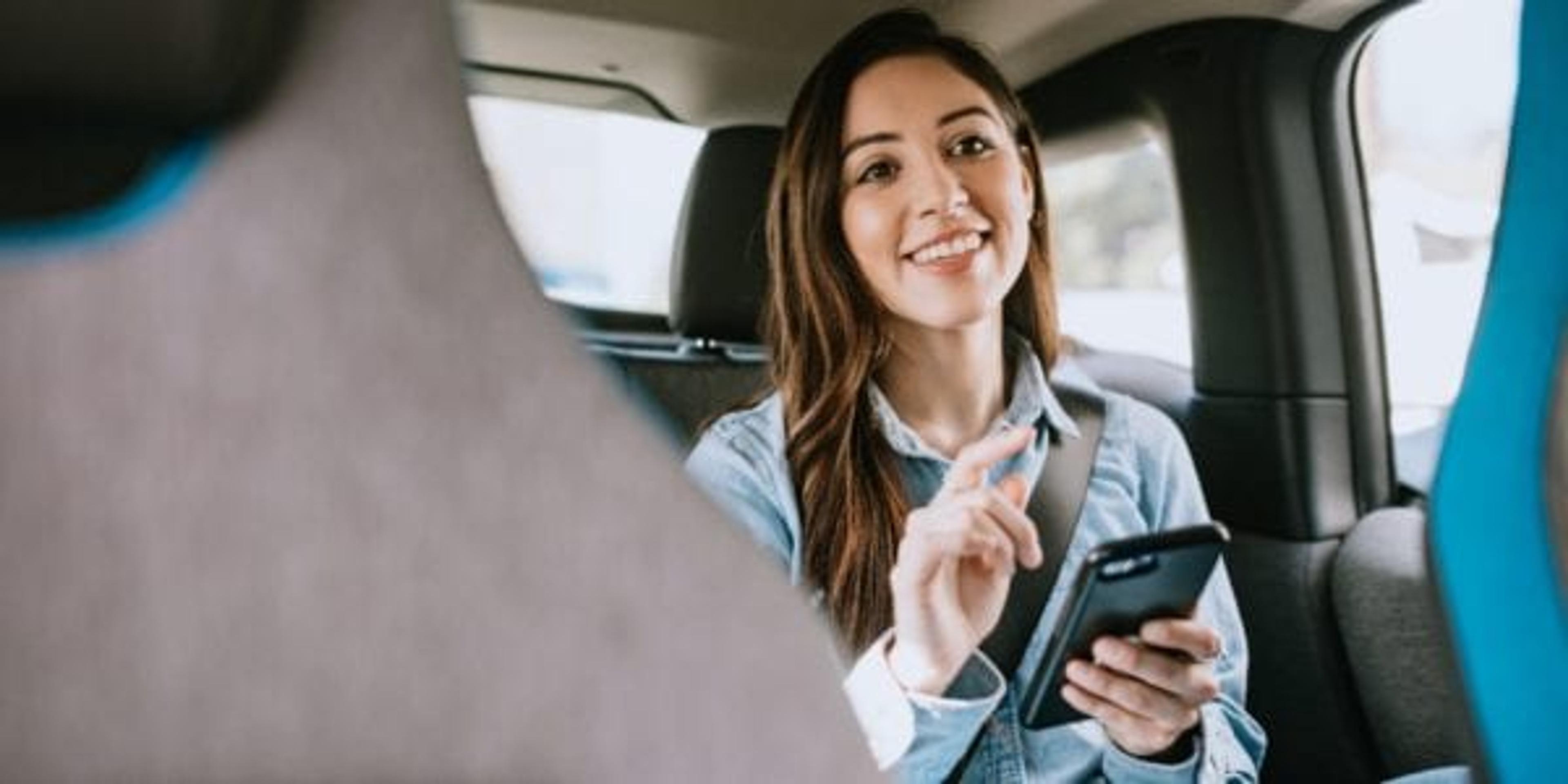 Woman in back seat of rideshare