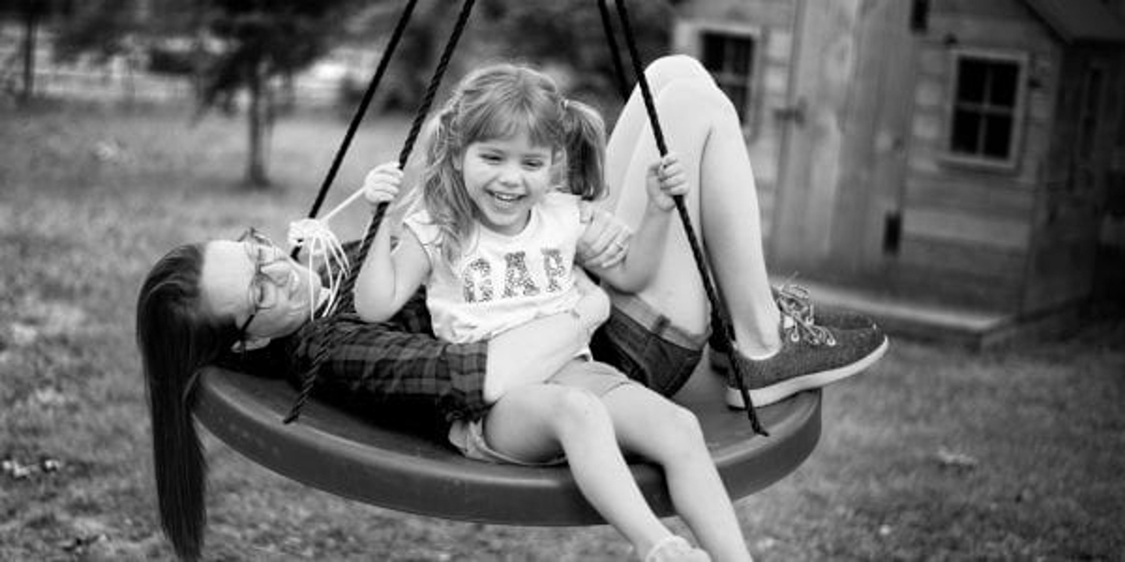 mom and daughter swinging