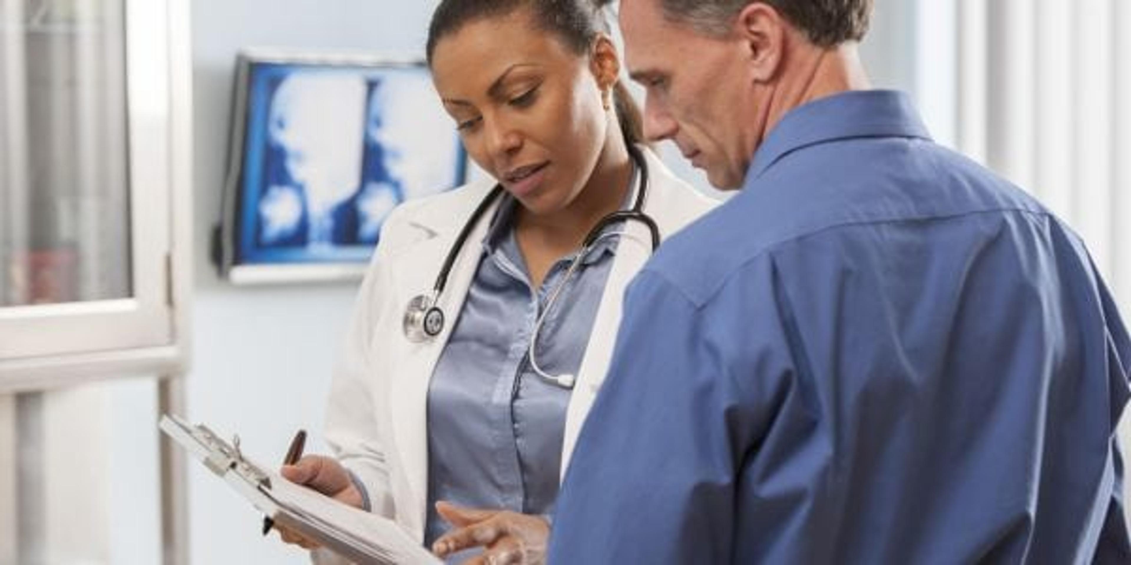 Female doctor talking with patient.