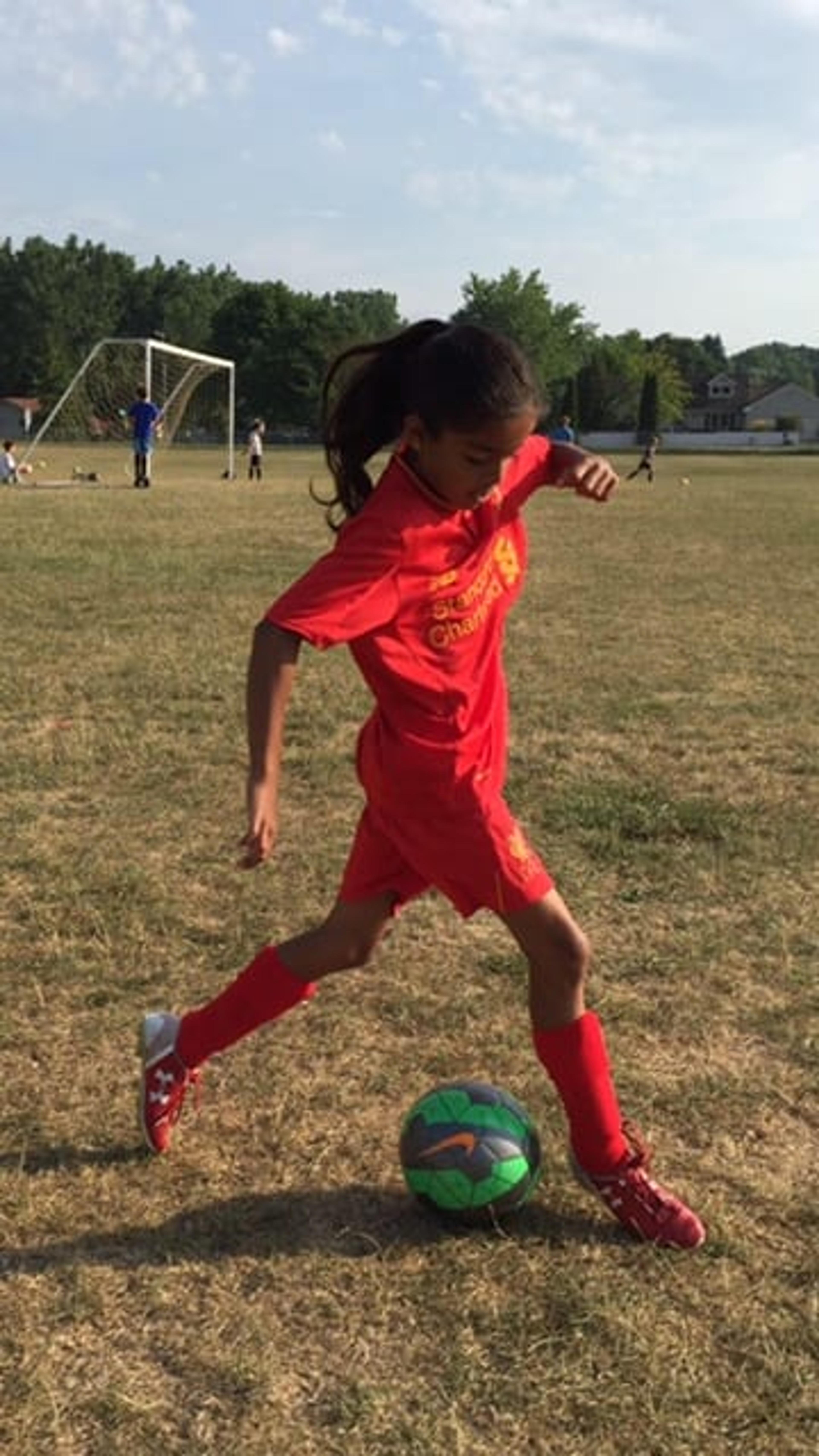 Naiya playing soccer