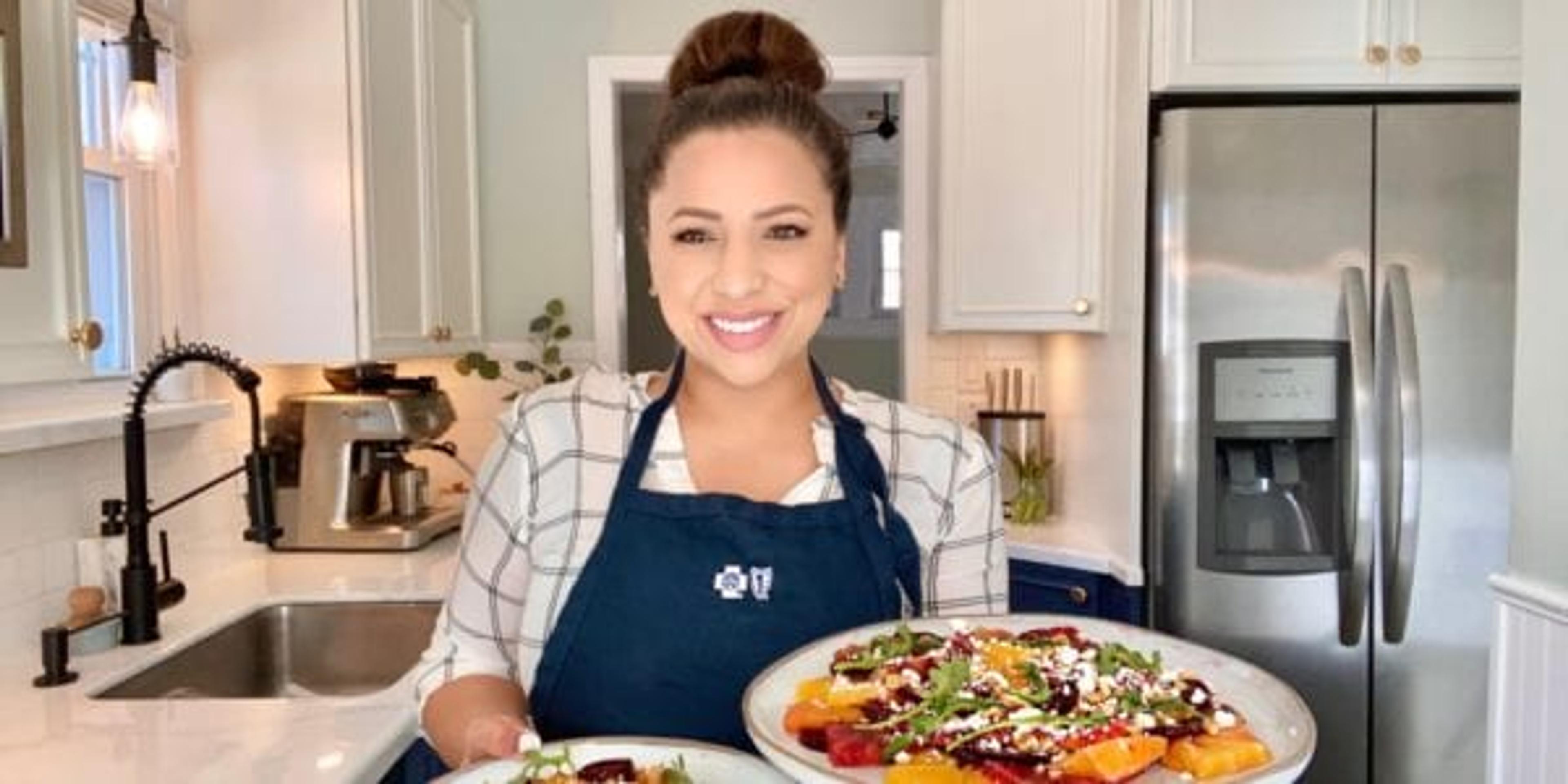 Shanthi Apello, Registered Dietician for Blue Cross Blue Shield of Michigan displays a colorful beet salad on two plates.