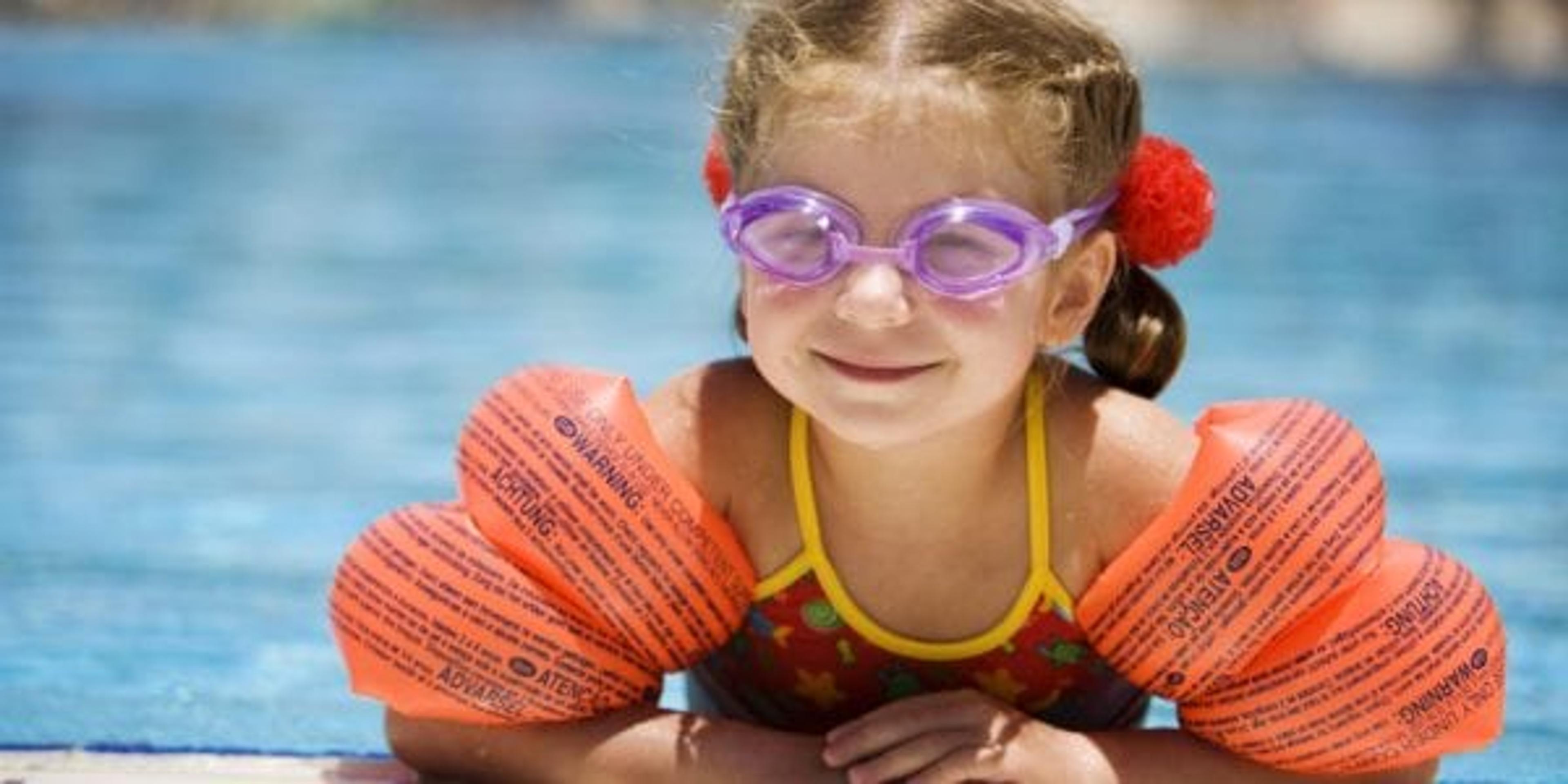 Little girl at edge of pool