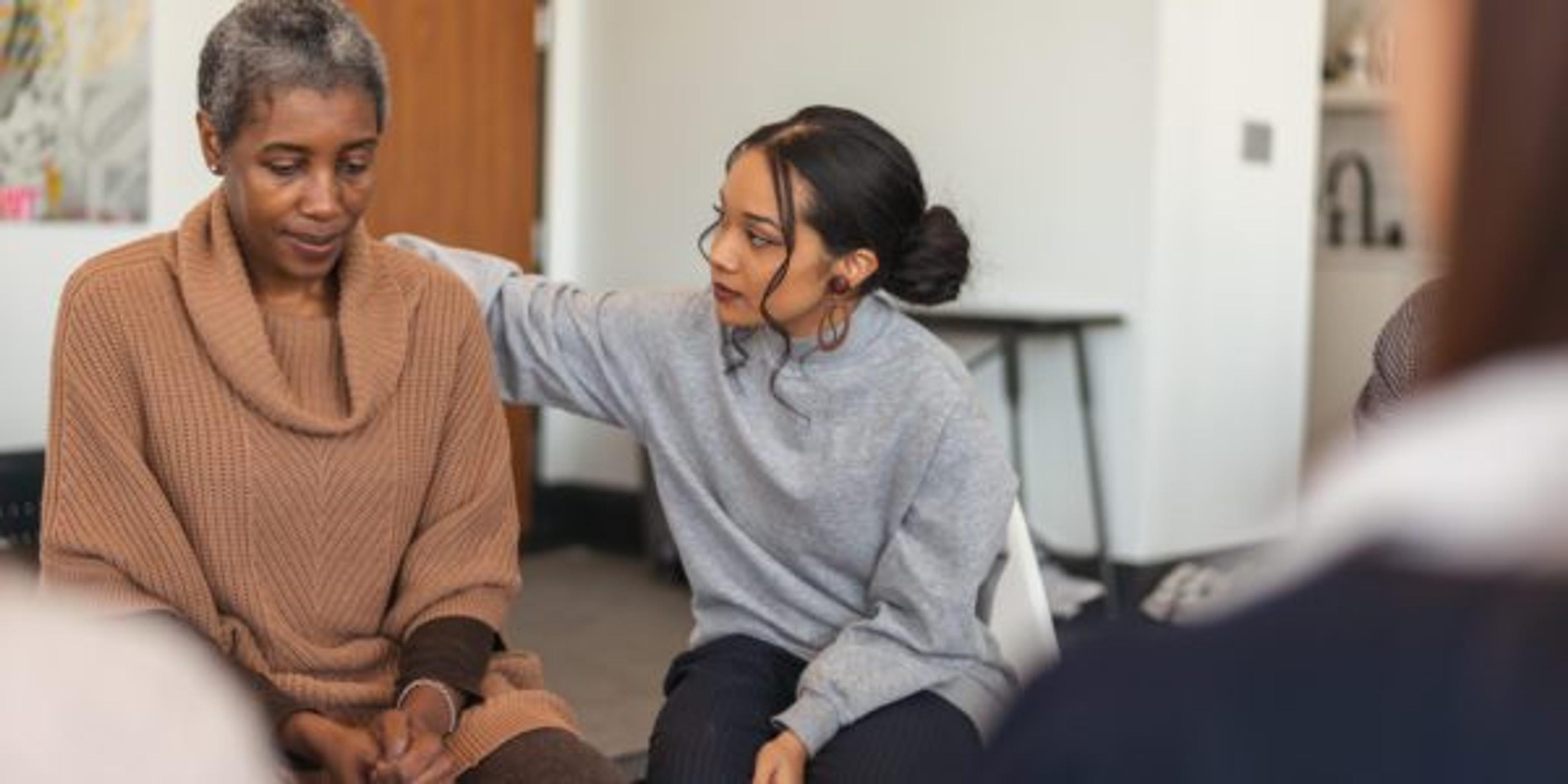 Young woman shows support in therapy session