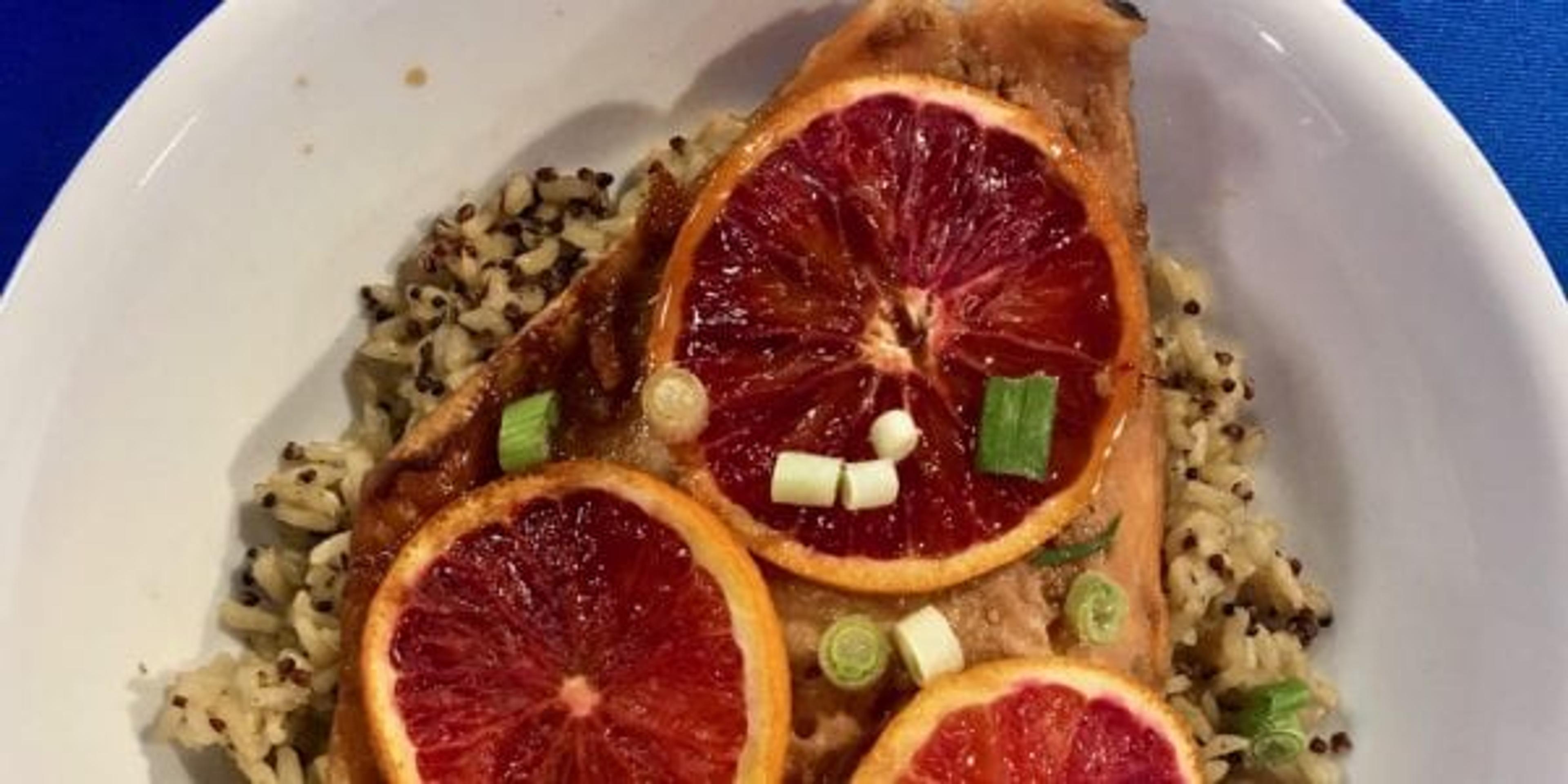 Salmon on a plate with blood oranges.