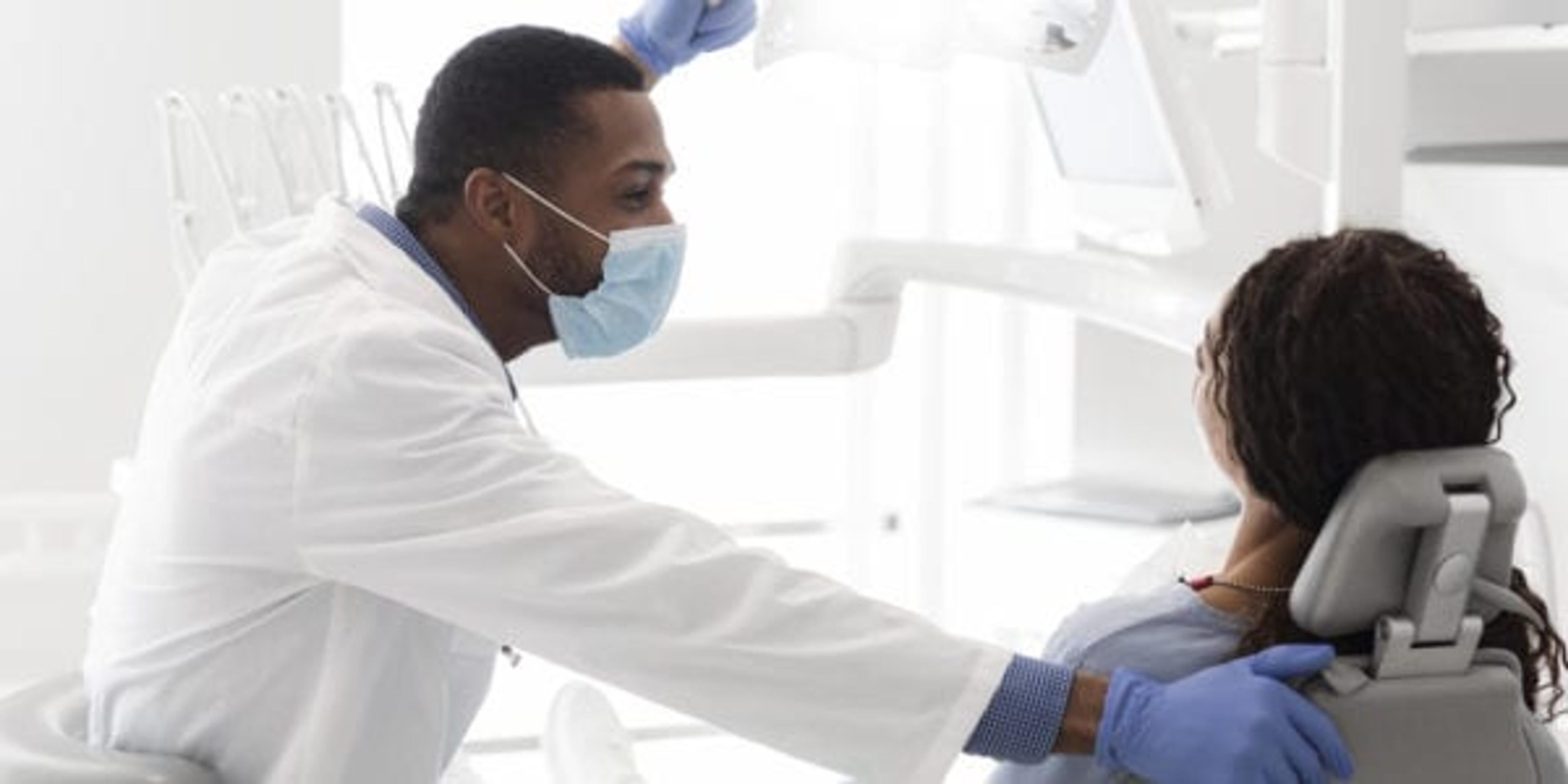 Asking the dentist a question during check-up