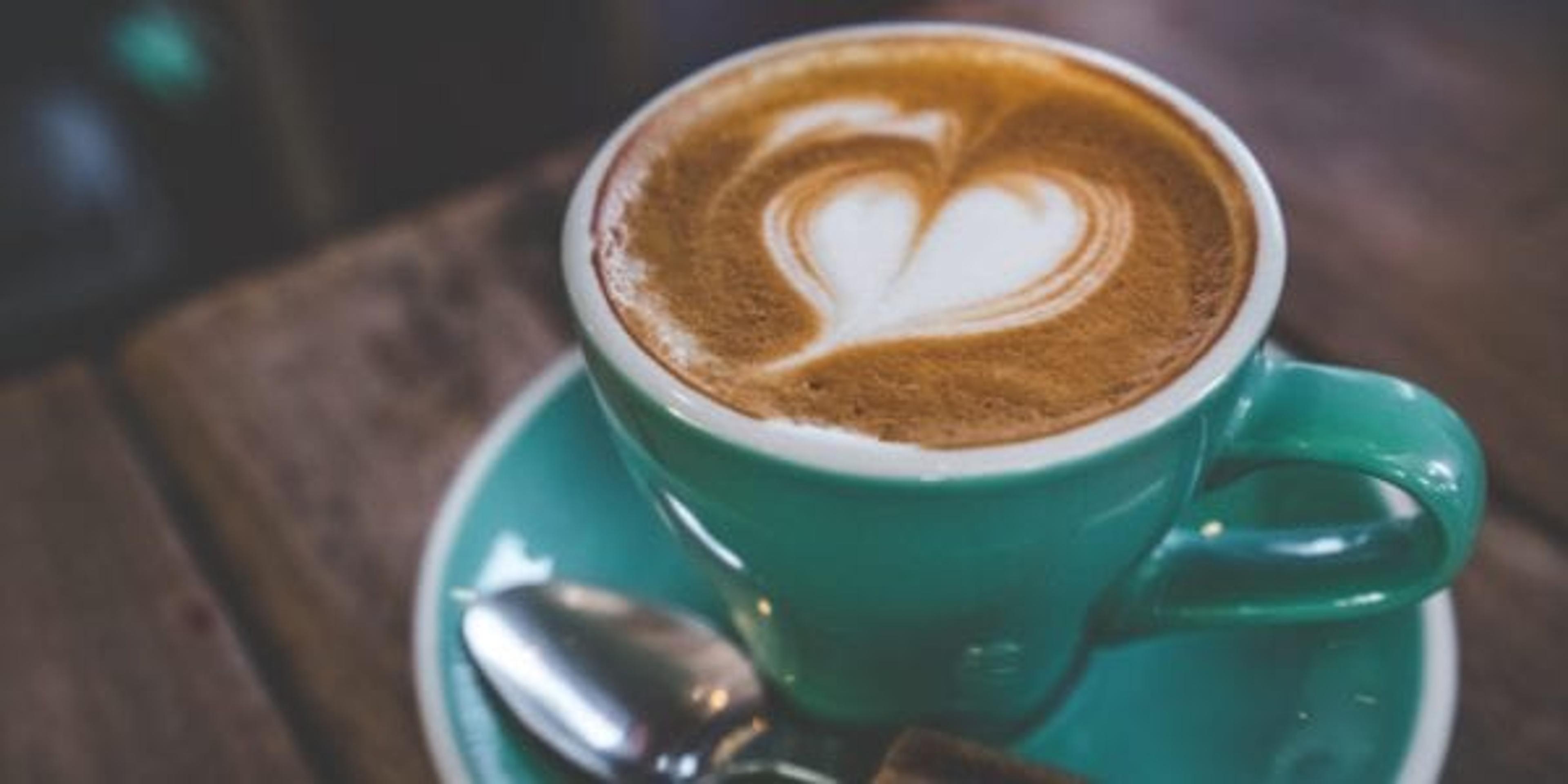 Latte in a mug with heart foam