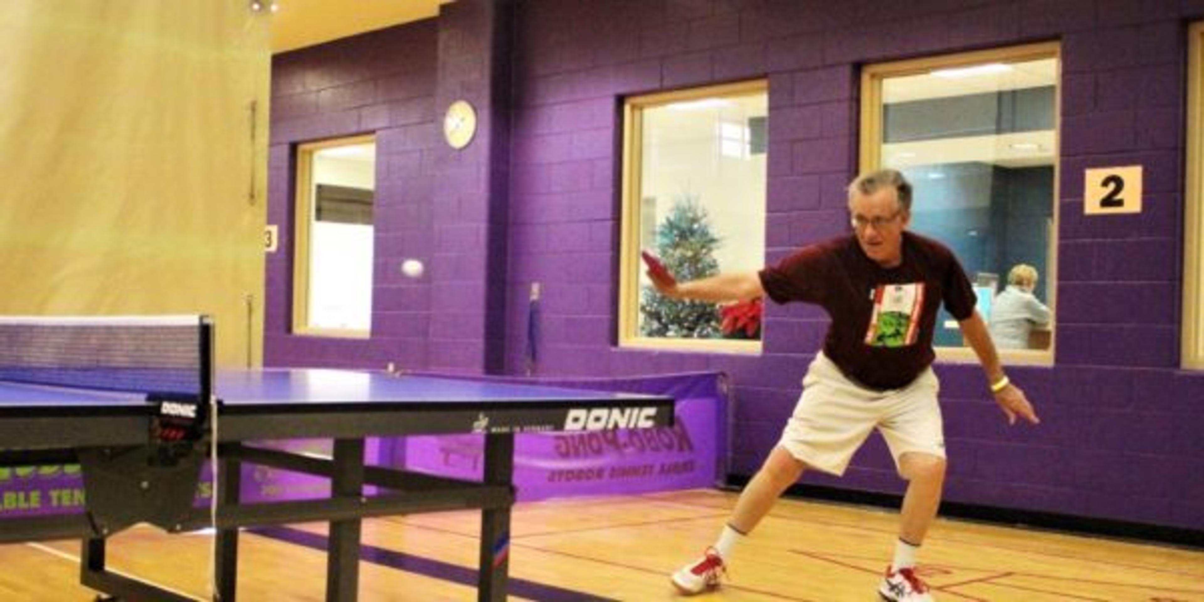 Bob Van Camp plays table tennis at the Older Persons Commission