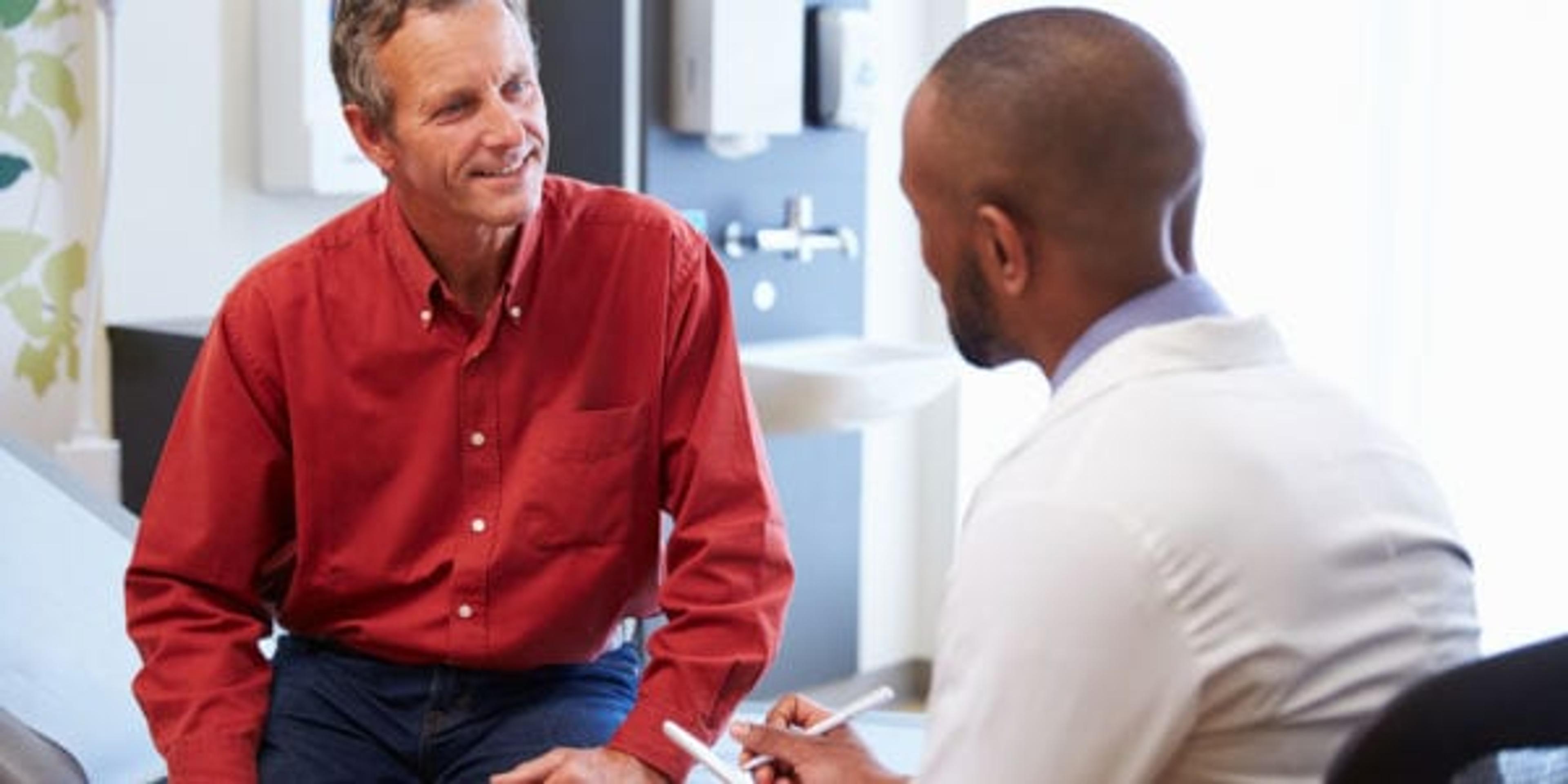 Man talking to his doctor.