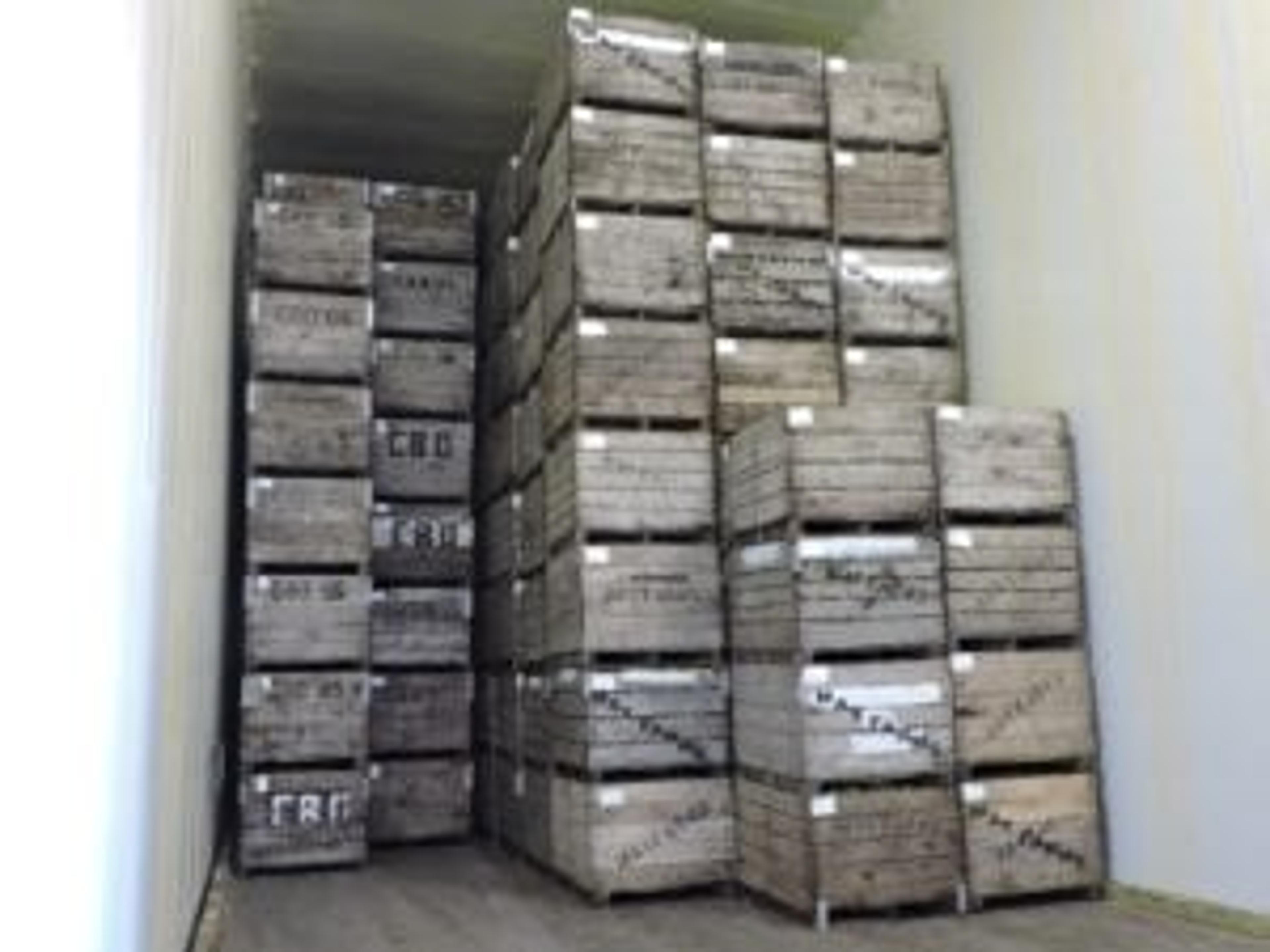 Apples packed in a cold storage room.