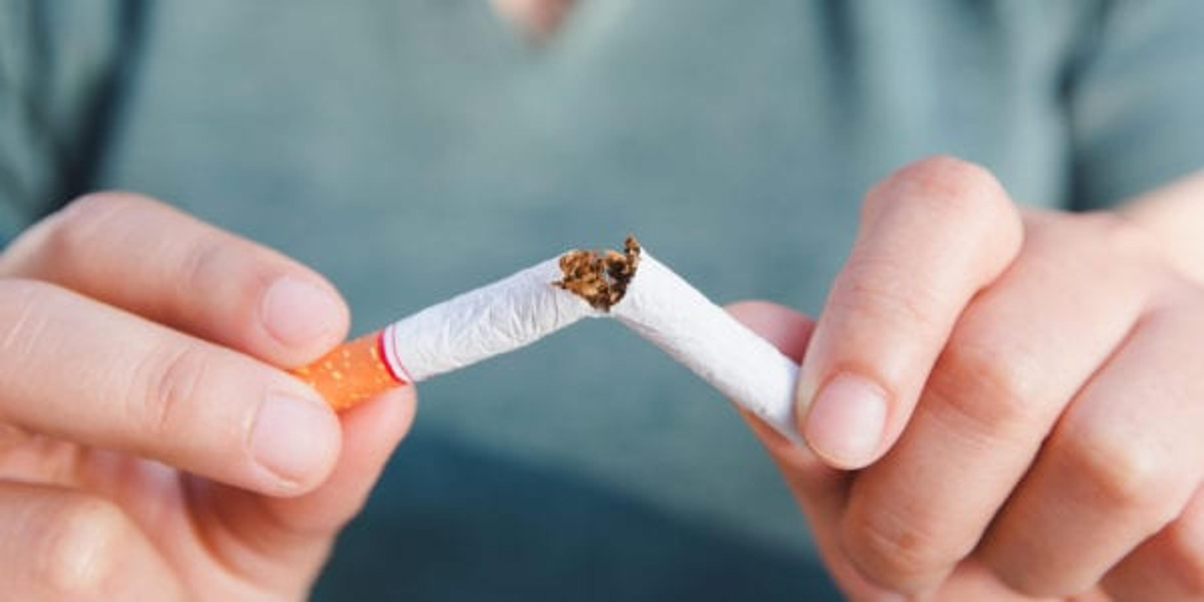 Stop cigarette, woman hands breaking the cigarette with clipping path