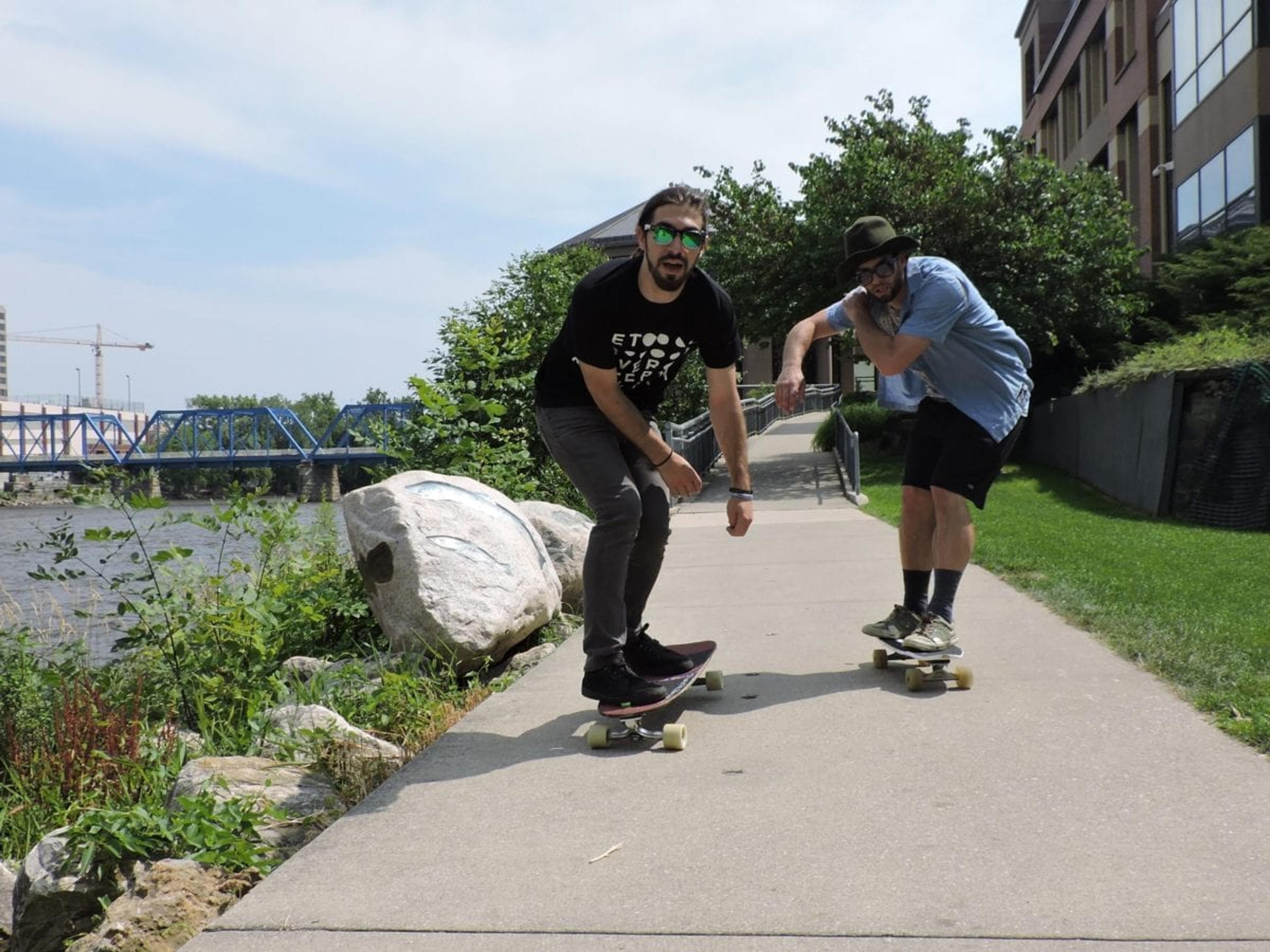 Ty Butler, left, and Mike Dallas, right, on an afternoon ride along the Grand River.
